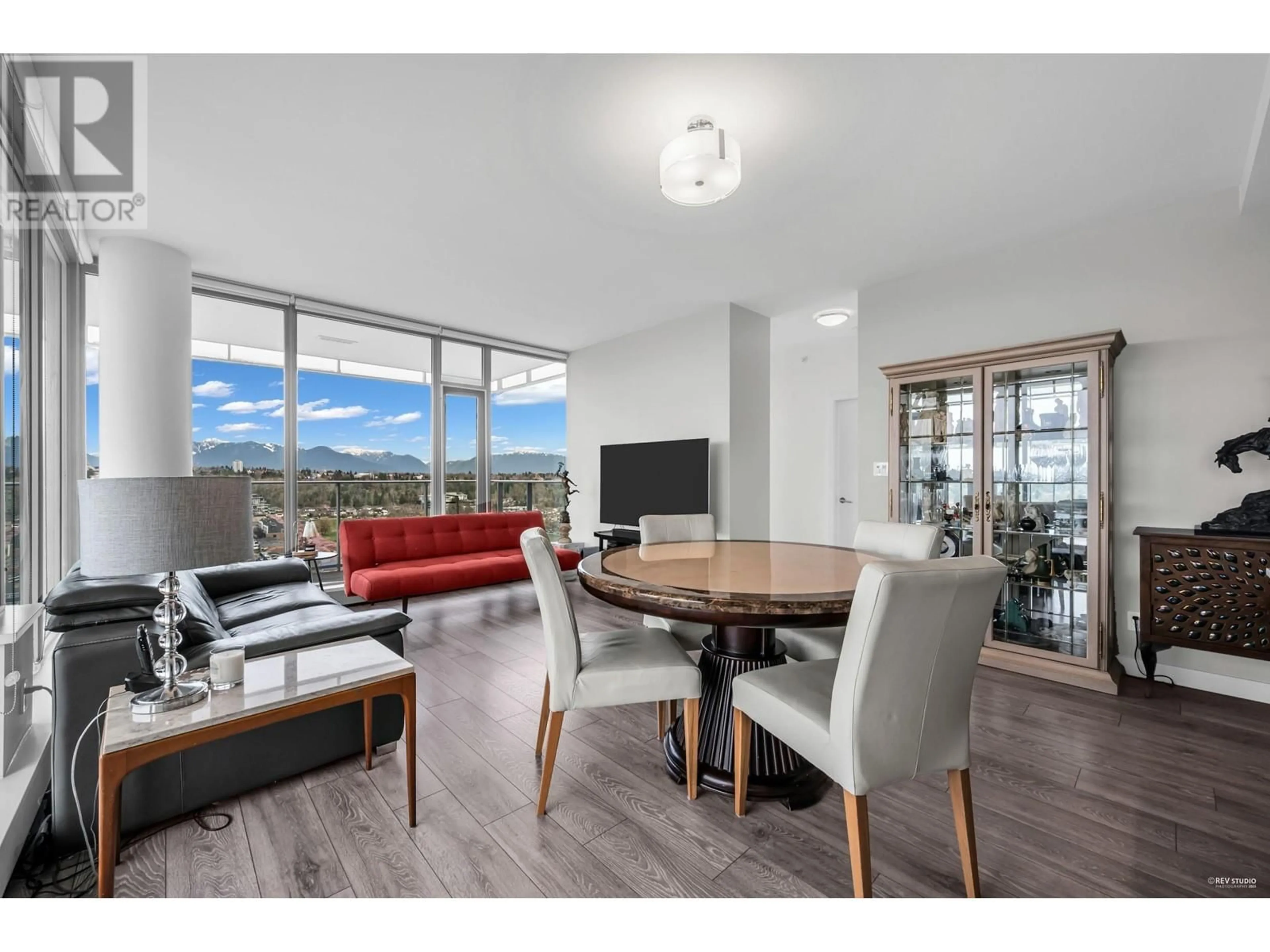 Living room with furniture, wood/laminate floor for 2501 - 8031 NUNAVUT LANE, Vancouver British Columbia V5X0C9