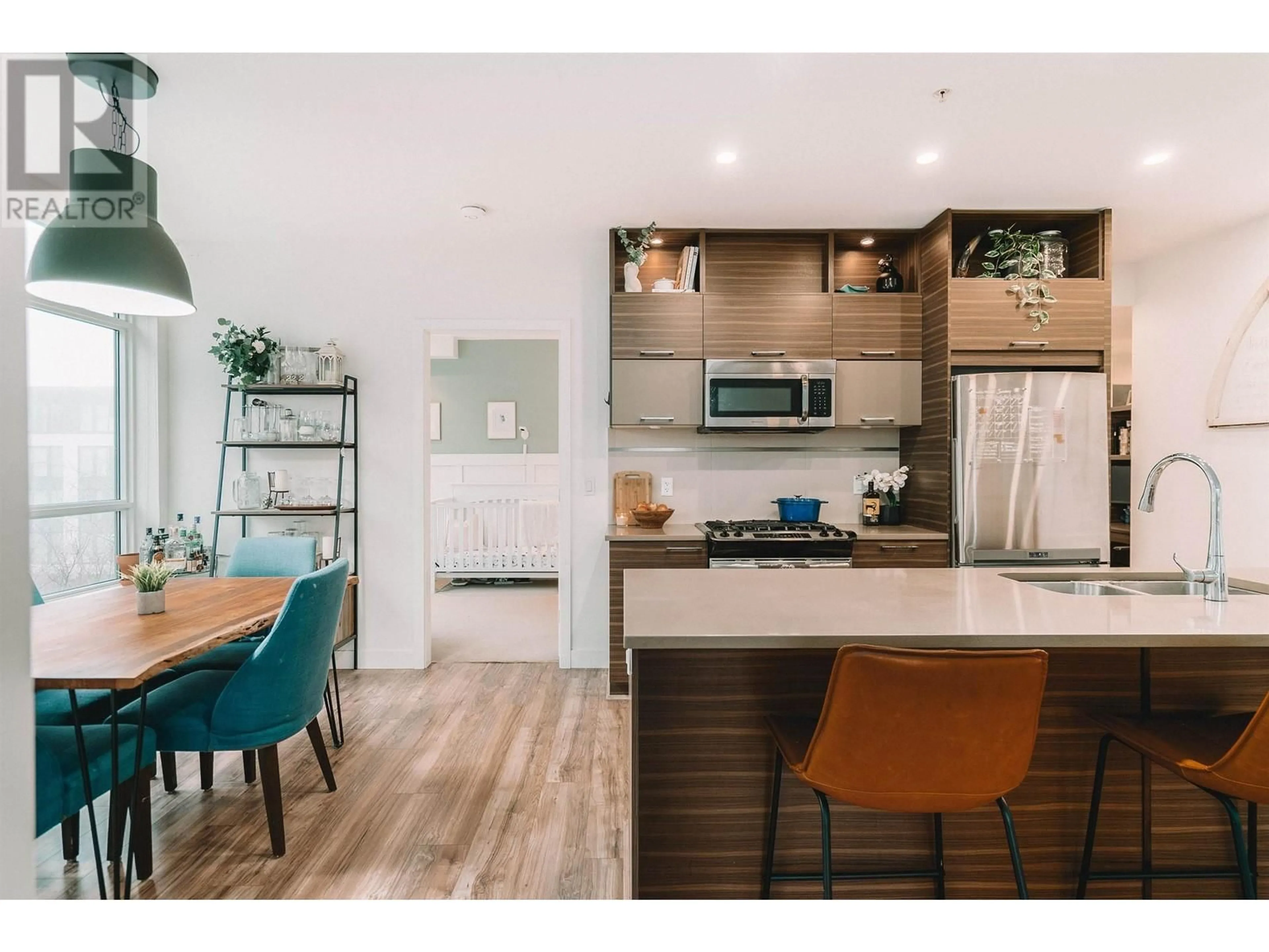 Open concept kitchen, wood/laminate floor for 111 - 9150 UNIVERSITY HIGH STREET, Burnaby British Columbia V5A0C5