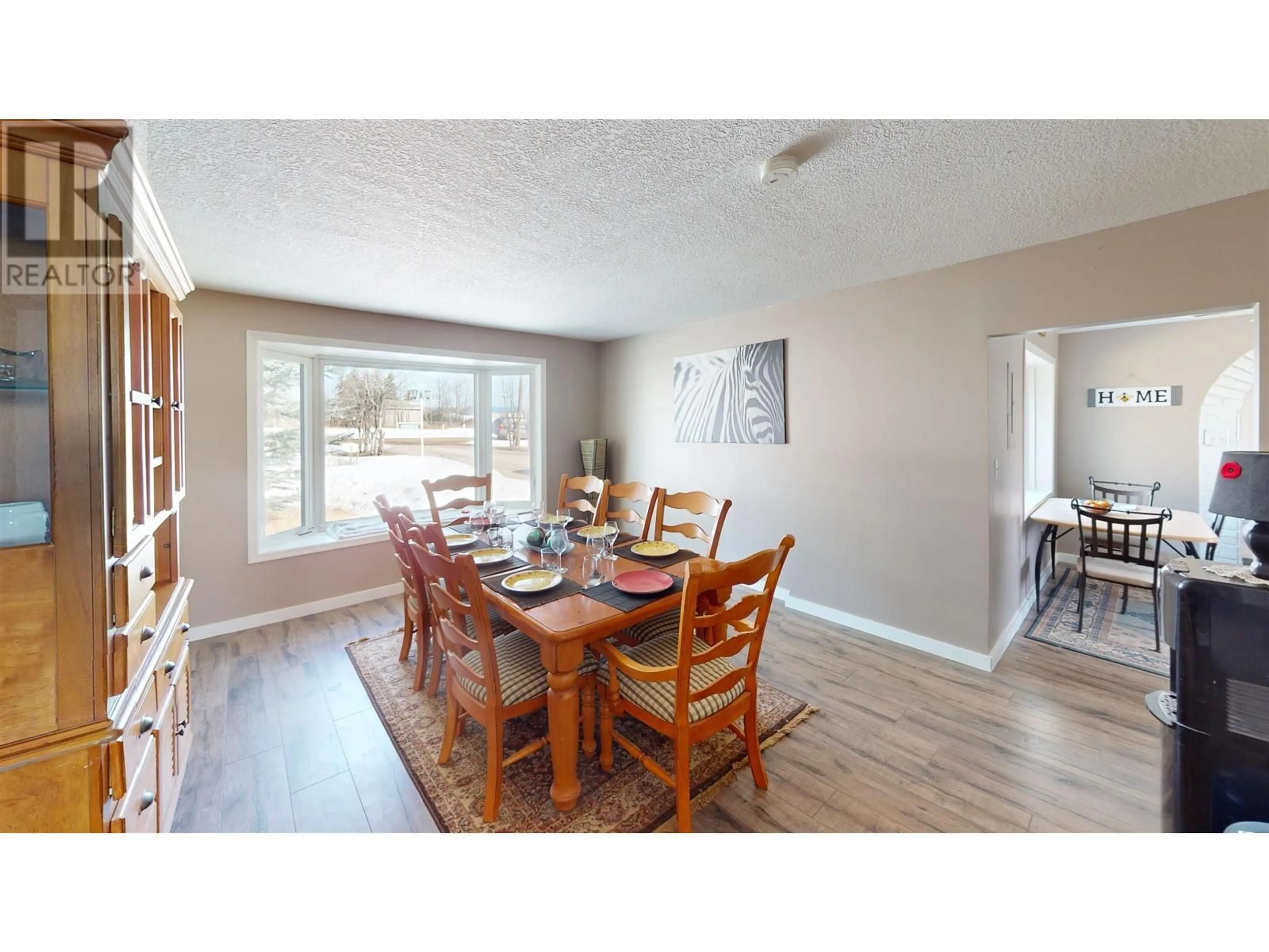 Dining room, wood/laminate floor for 12279 COTTONWOOD AVENUE, Fort St. John British Columbia V1J8B1