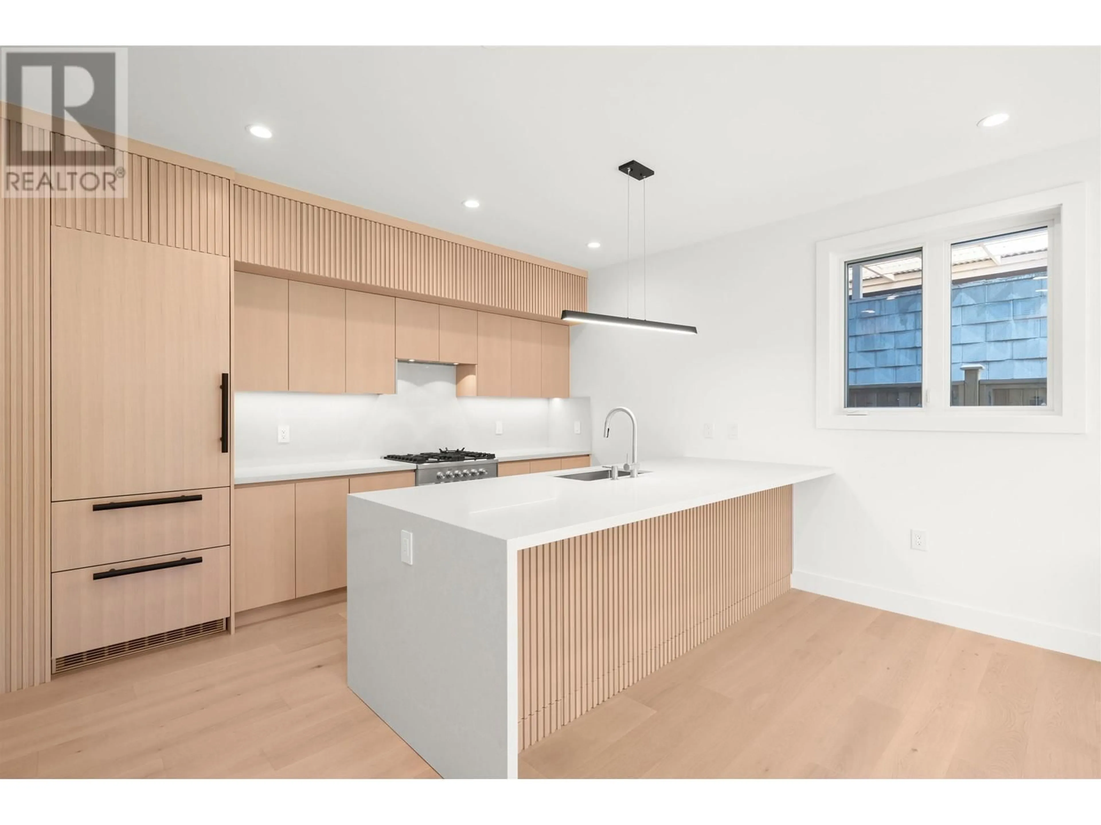 Open concept kitchen, wood/laminate floor for 2 - 760 48 AVENUE, Vancouver British Columbia V5Z2R9