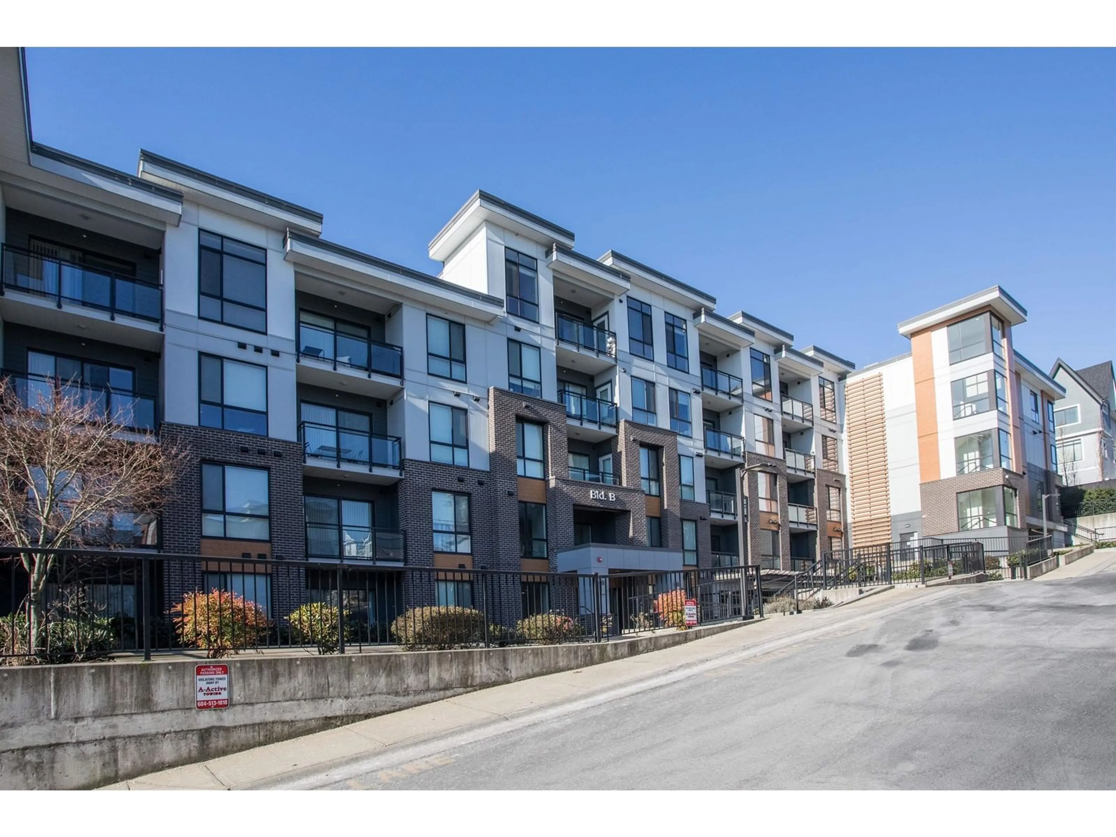 A pic from outside/outdoor area/front of a property/back of a property/a pic from drone, street for b210 - 20087 68, Langley British Columbia V2Y0Y4
