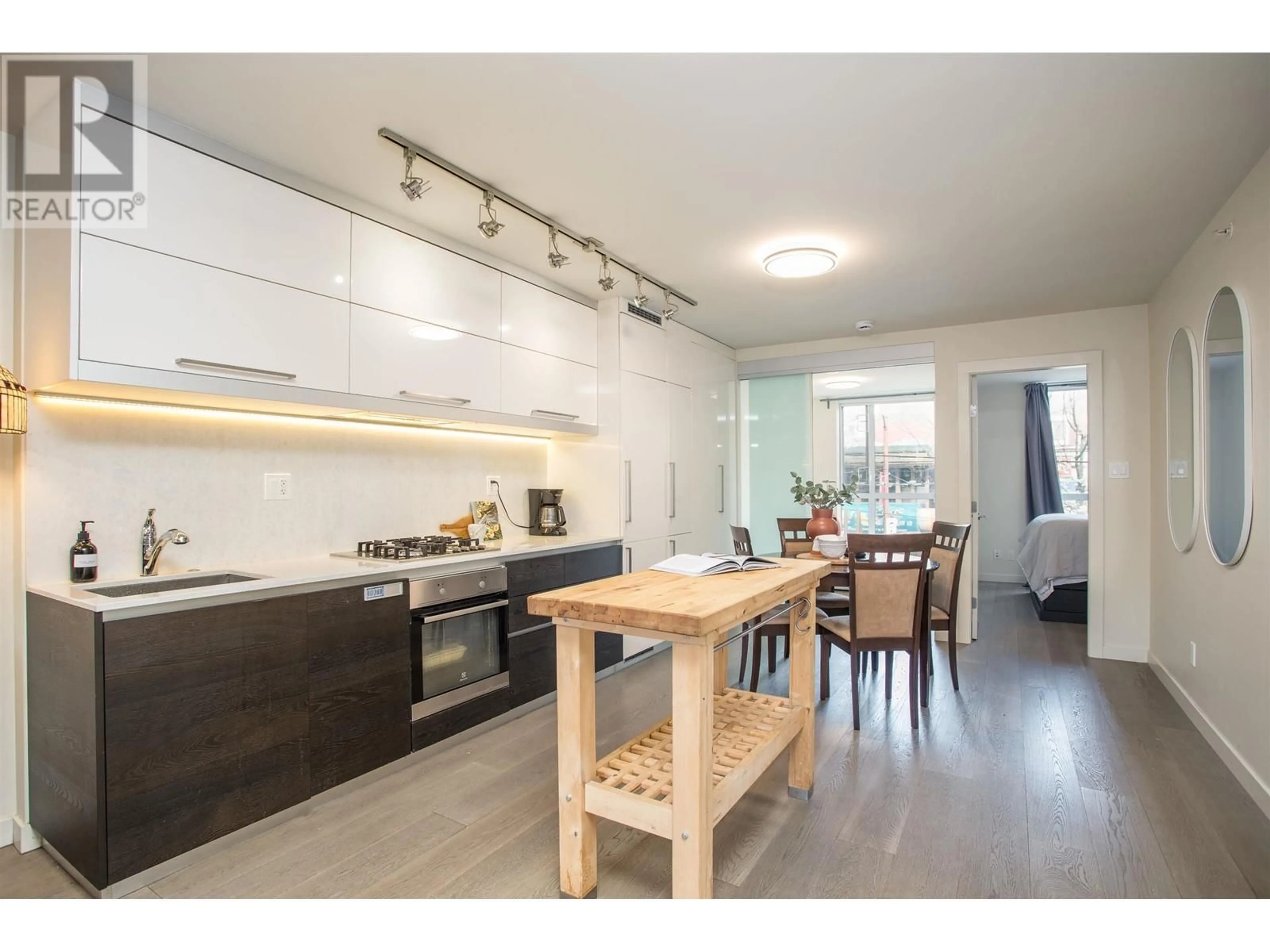 Open concept kitchen, wood/laminate floor for 208 - 189 KEEFER STREET, Vancouver British Columbia V6A0C8