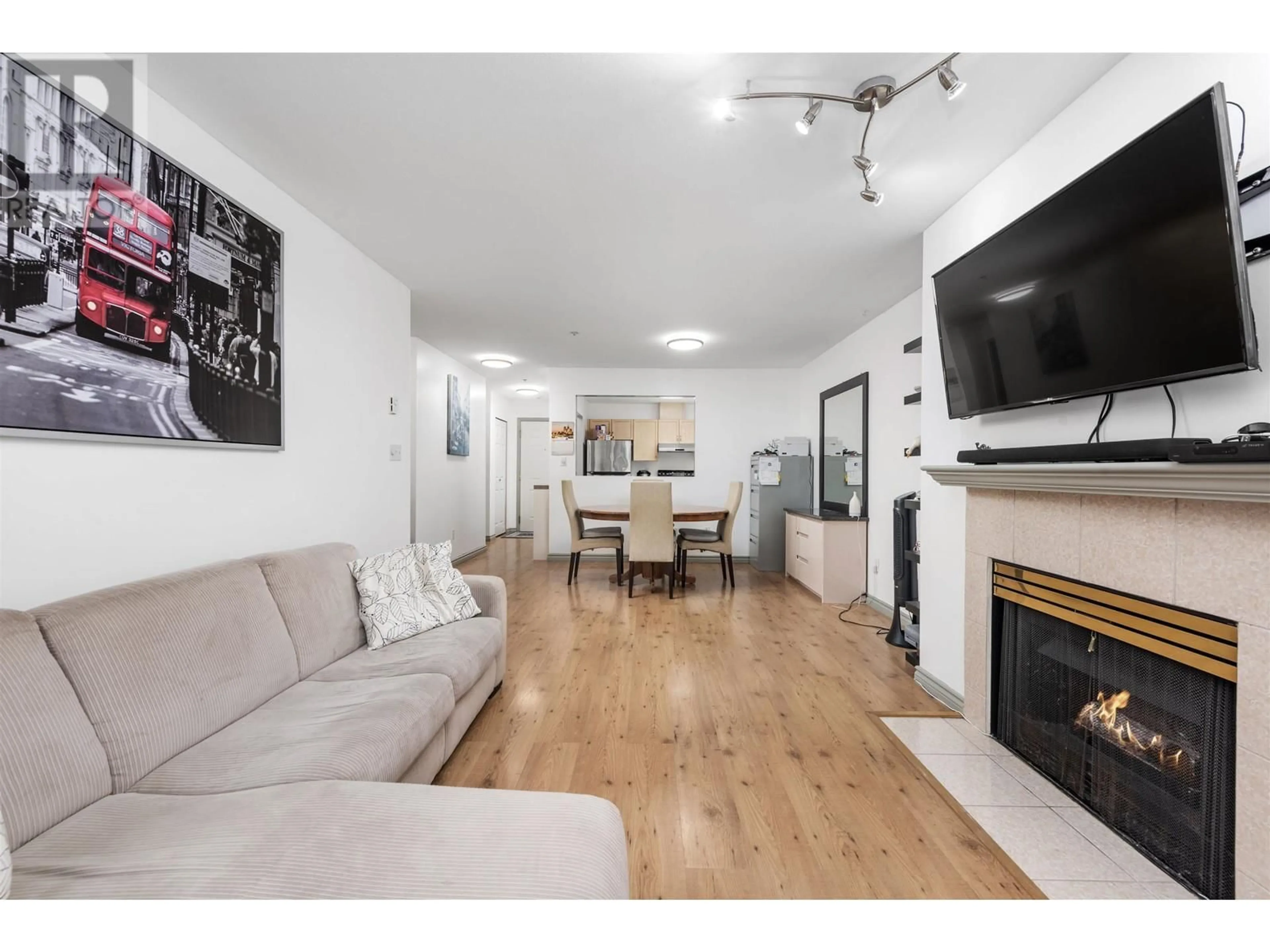 Living room with furniture, wood/laminate floor for 115 - 3400 MARINE DRIVE, Vancouver British Columbia V5S4P8