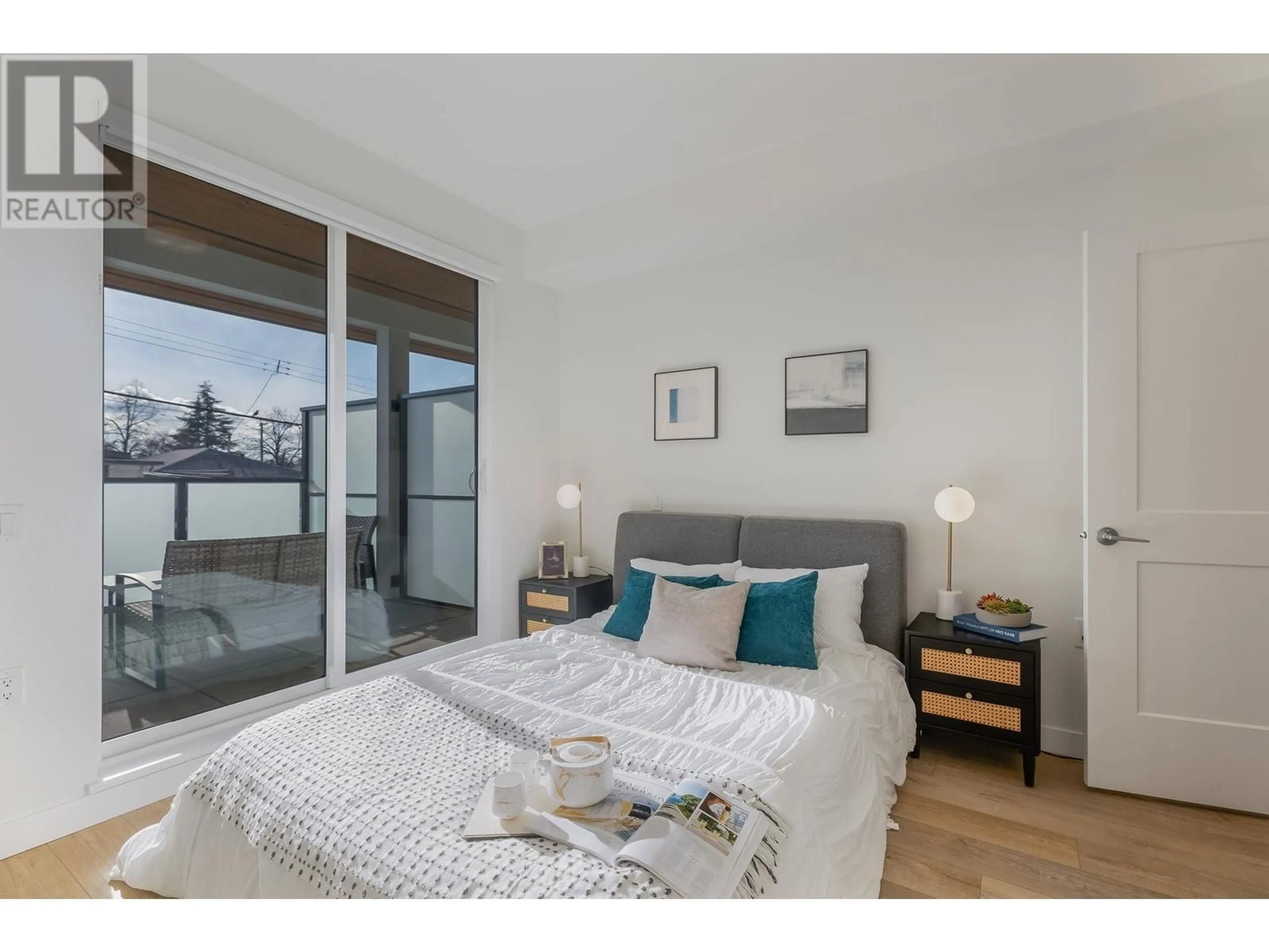 Bedroom with bed, wood/laminate floor for 204 - 4933 CLARENDON STREET, Vancouver British Columbia V5R3J3