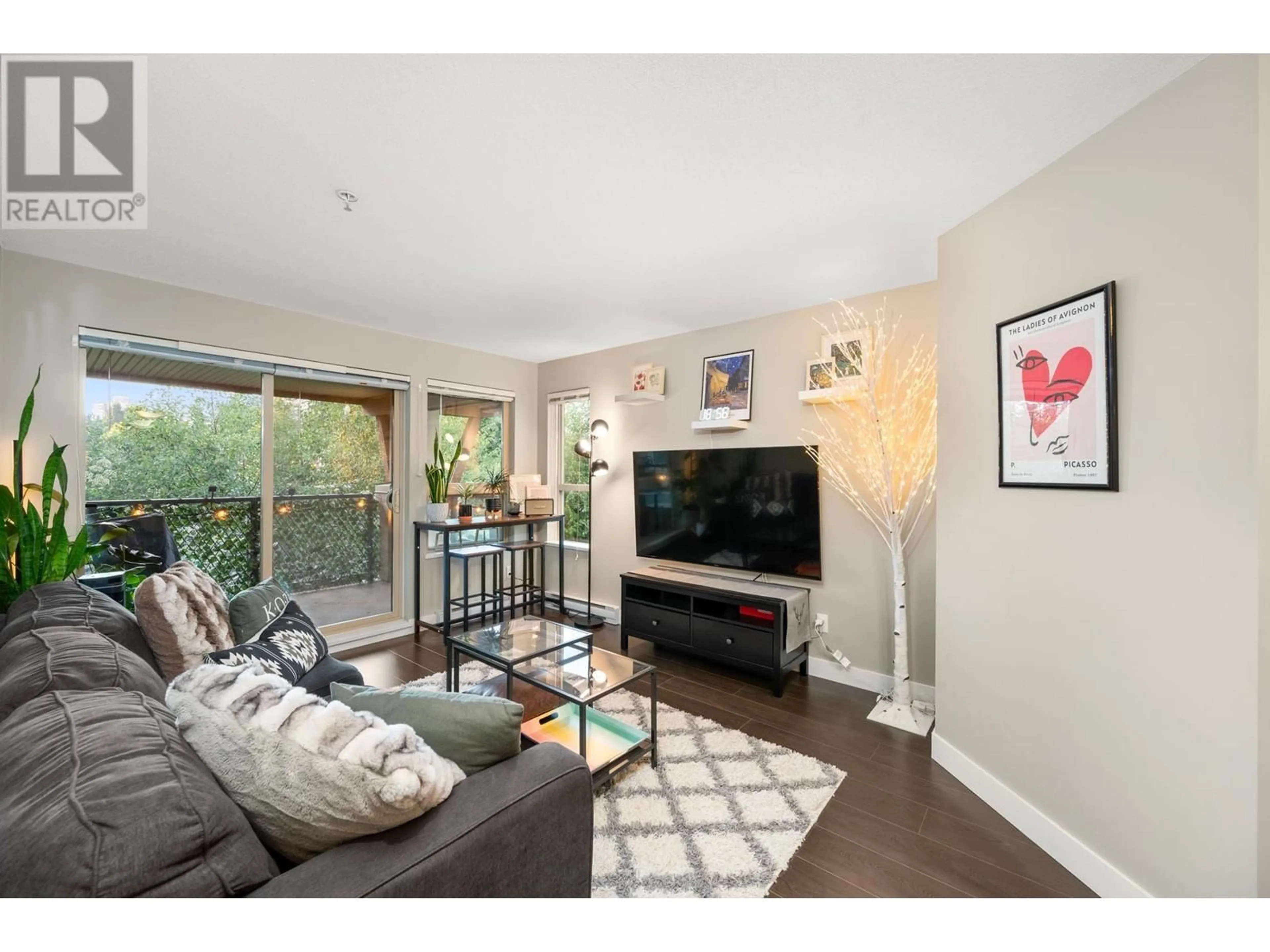 Living room with furniture, wood/laminate floor for 301 - 7131 STRIDE AVENUE, Burnaby British Columbia V3N0E3