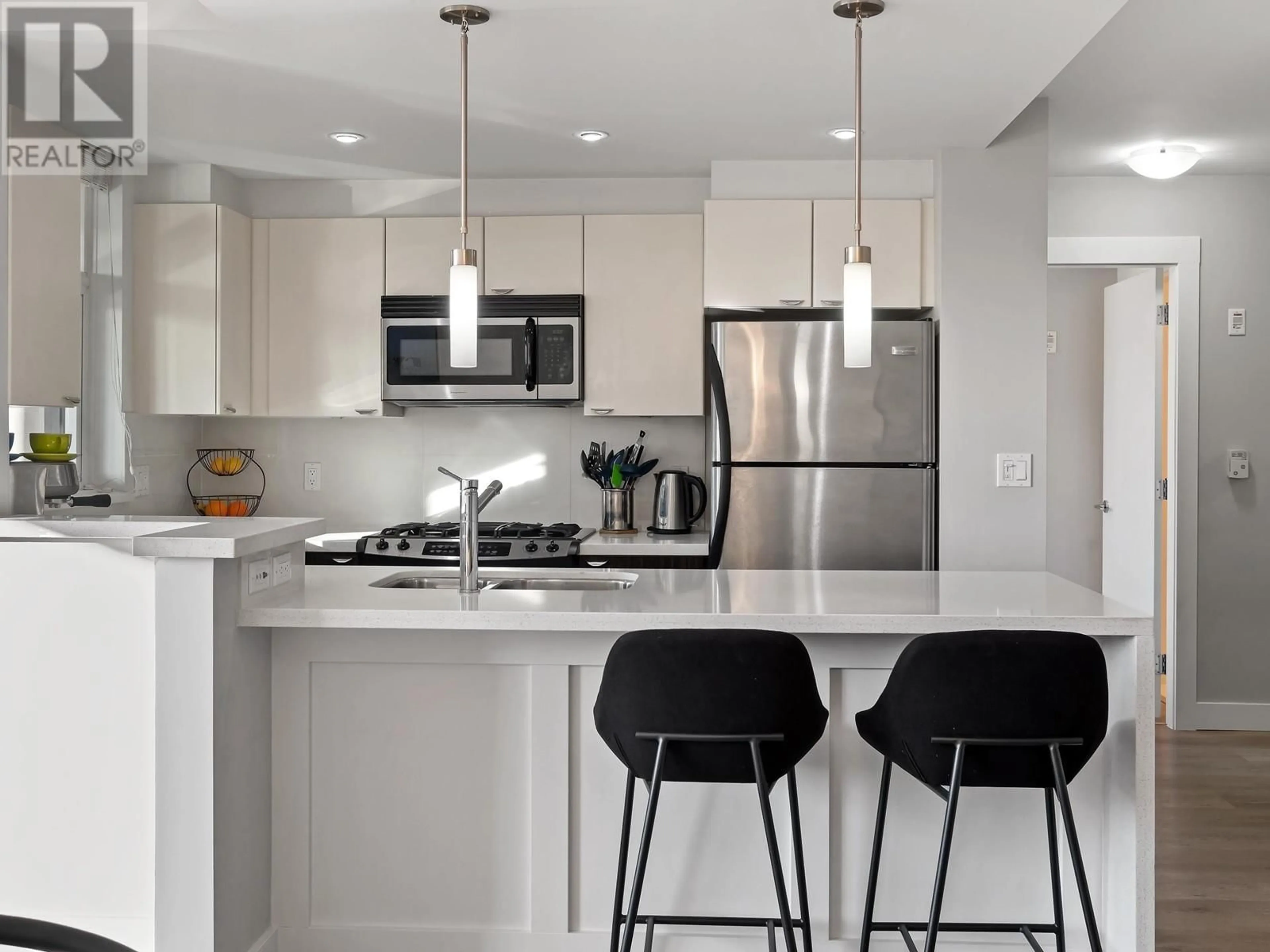 Open concept kitchen, ceramic/tile floor for 308 - 160 3RD STREET, North Vancouver British Columbia V7M0A9