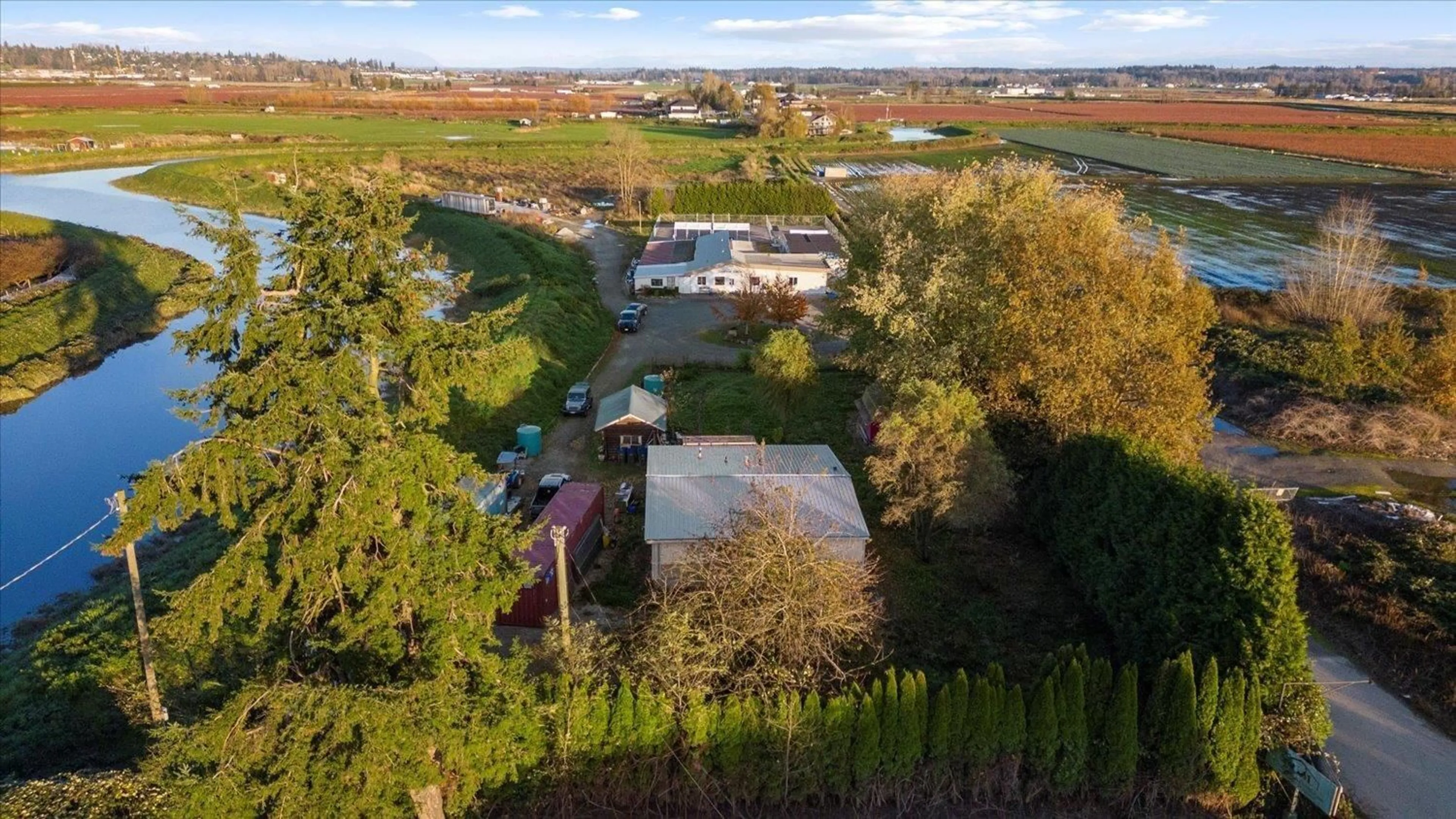 A pic from outside/outdoor area/front of a property/back of a property/a pic from drone, water/lake/river/ocean view for 4806 168, Surrey British Columbia V3S0L2