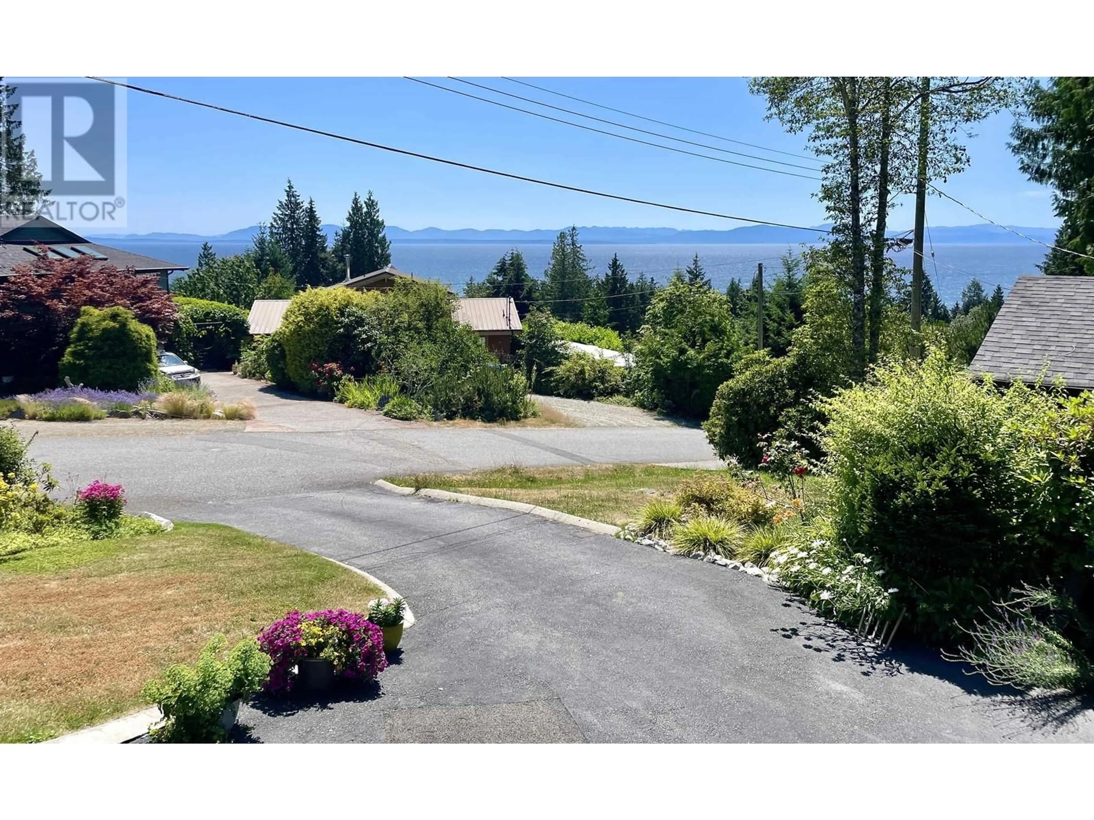 A pic from outside/outdoor area/front of a property/back of a property/a pic from drone, mountain view for 1436 VELVET ROAD, Gibsons British Columbia V0N1V5