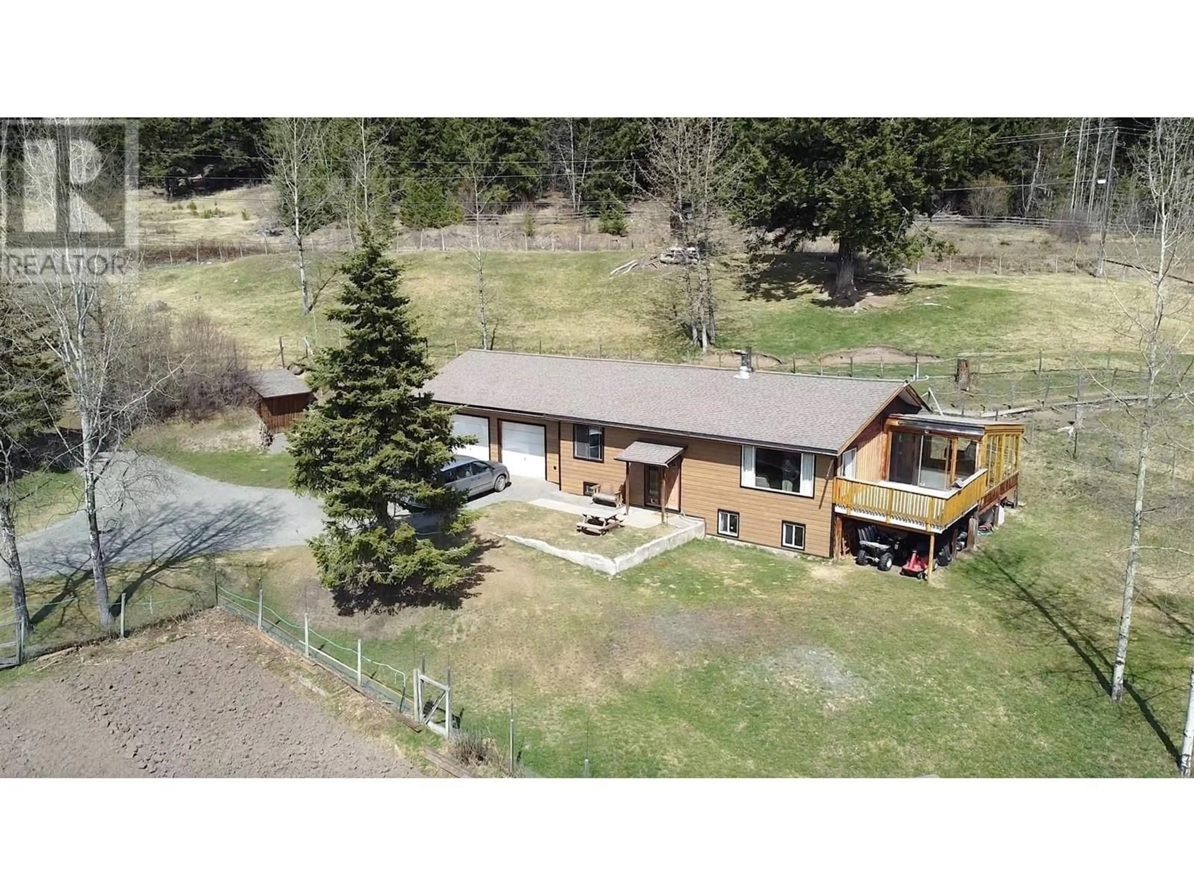 A pic from outside/outdoor area/front of a property/back of a property/a pic from drone, unknown for 7115 CONNIE ROAD, Bridge Lake British Columbia V0K1X2