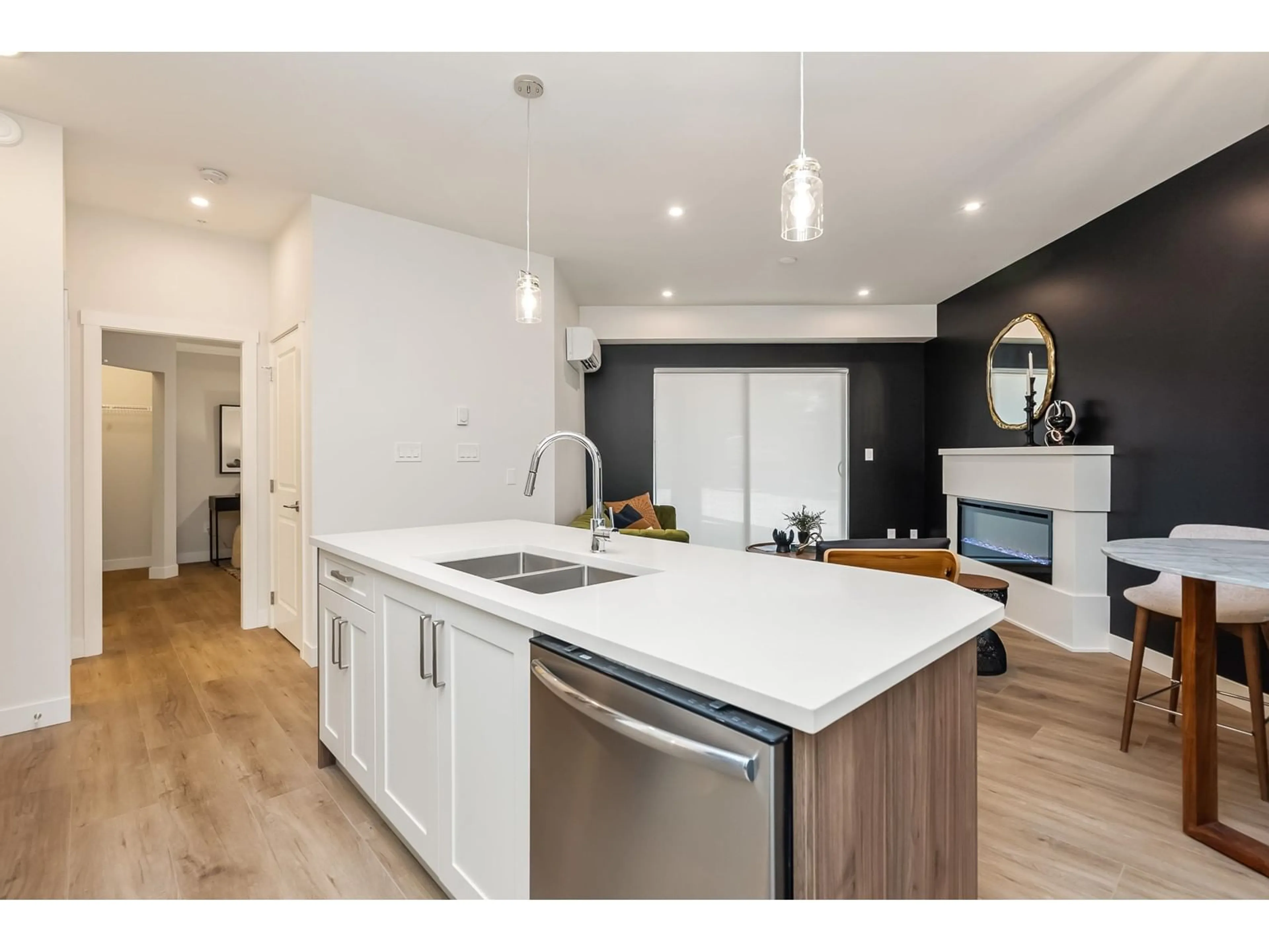 Open concept kitchen, wood/laminate floor for 203 - 8497 YOUNG ROAD, Chilliwack British Columbia V2P4P2
