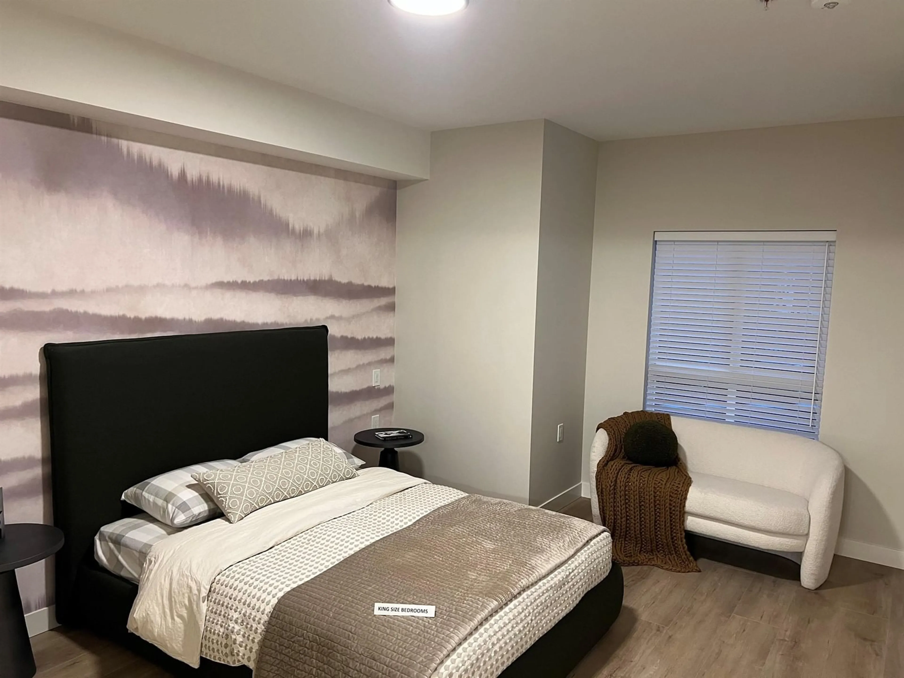Bedroom with bed, wood/laminate floor for 203 - 8497 YOUNG ROAD, Chilliwack British Columbia V2P4P2