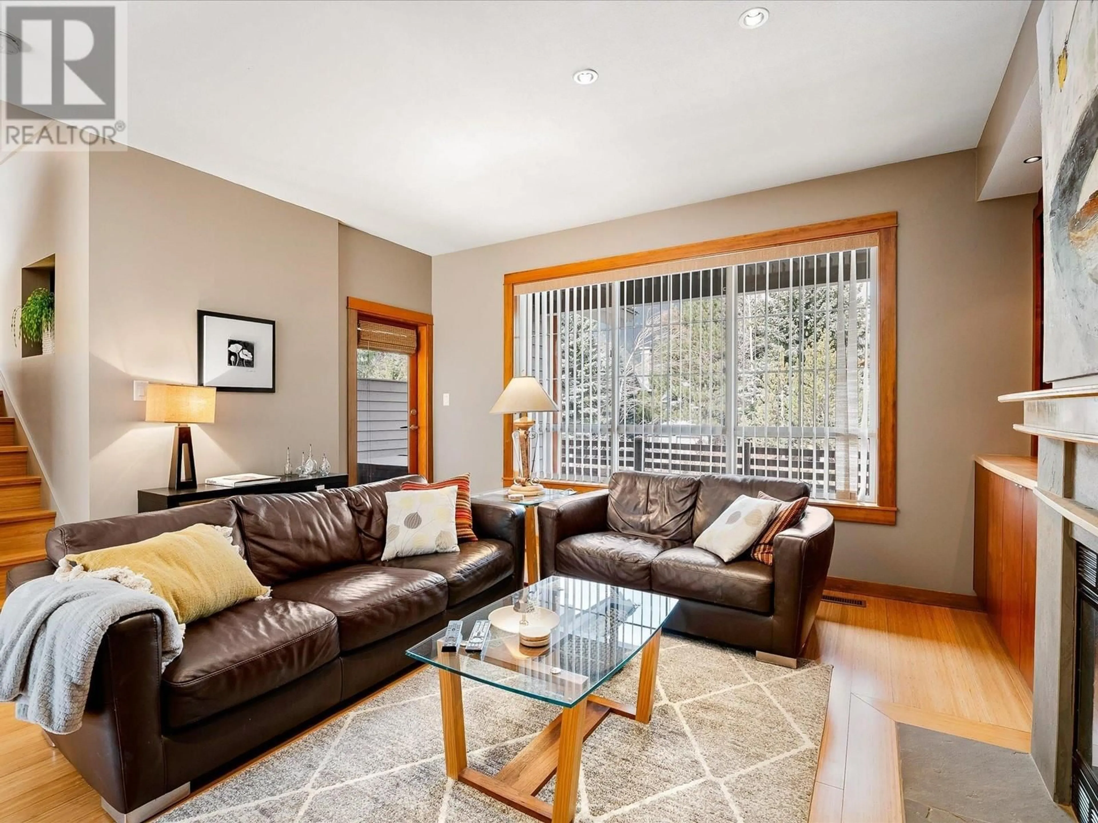 Living room with furniture, wood/laminate floor for 10 - 8030 NICKLAUS NORTH BOULEVARD, Whistler British Columbia V8E1J7