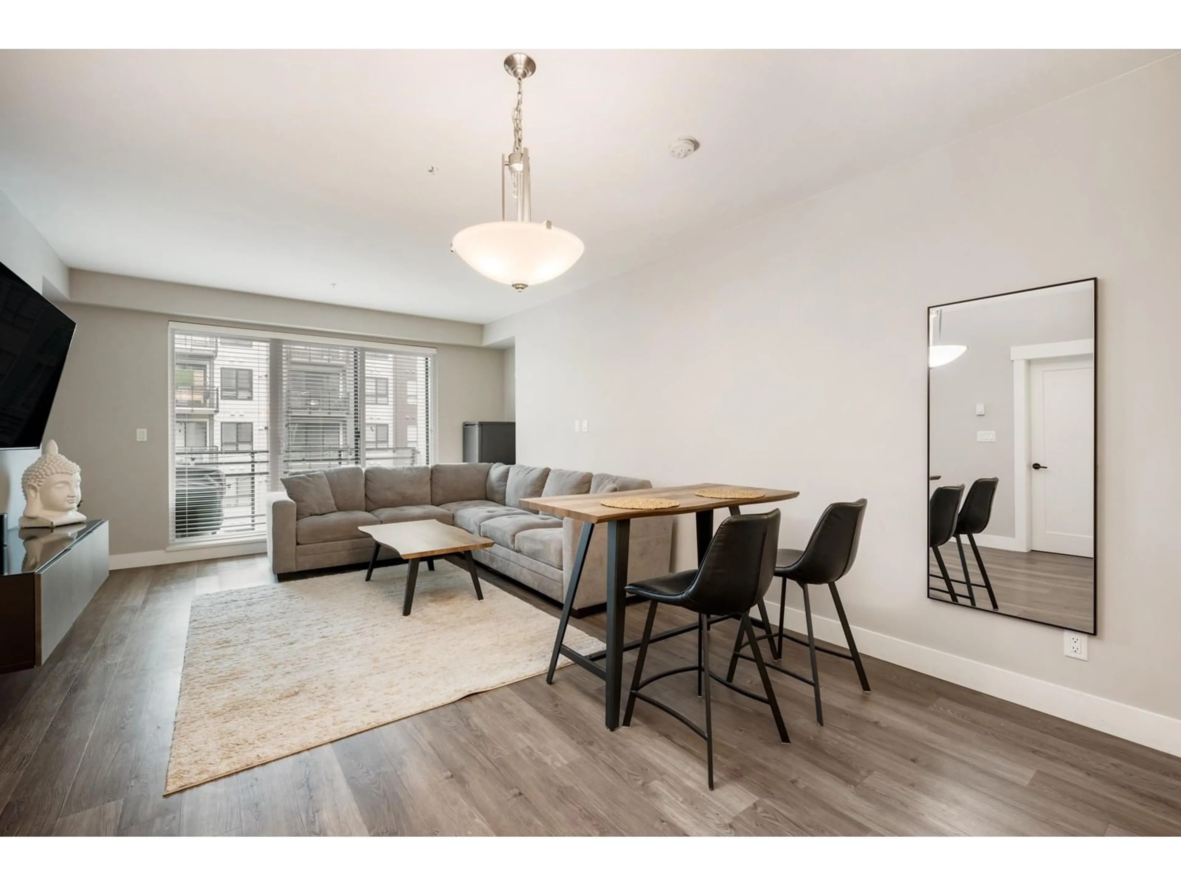 Living room with furniture, wood/laminate floor for B308 - 20838 78B, Langley British Columbia V2Y3M2