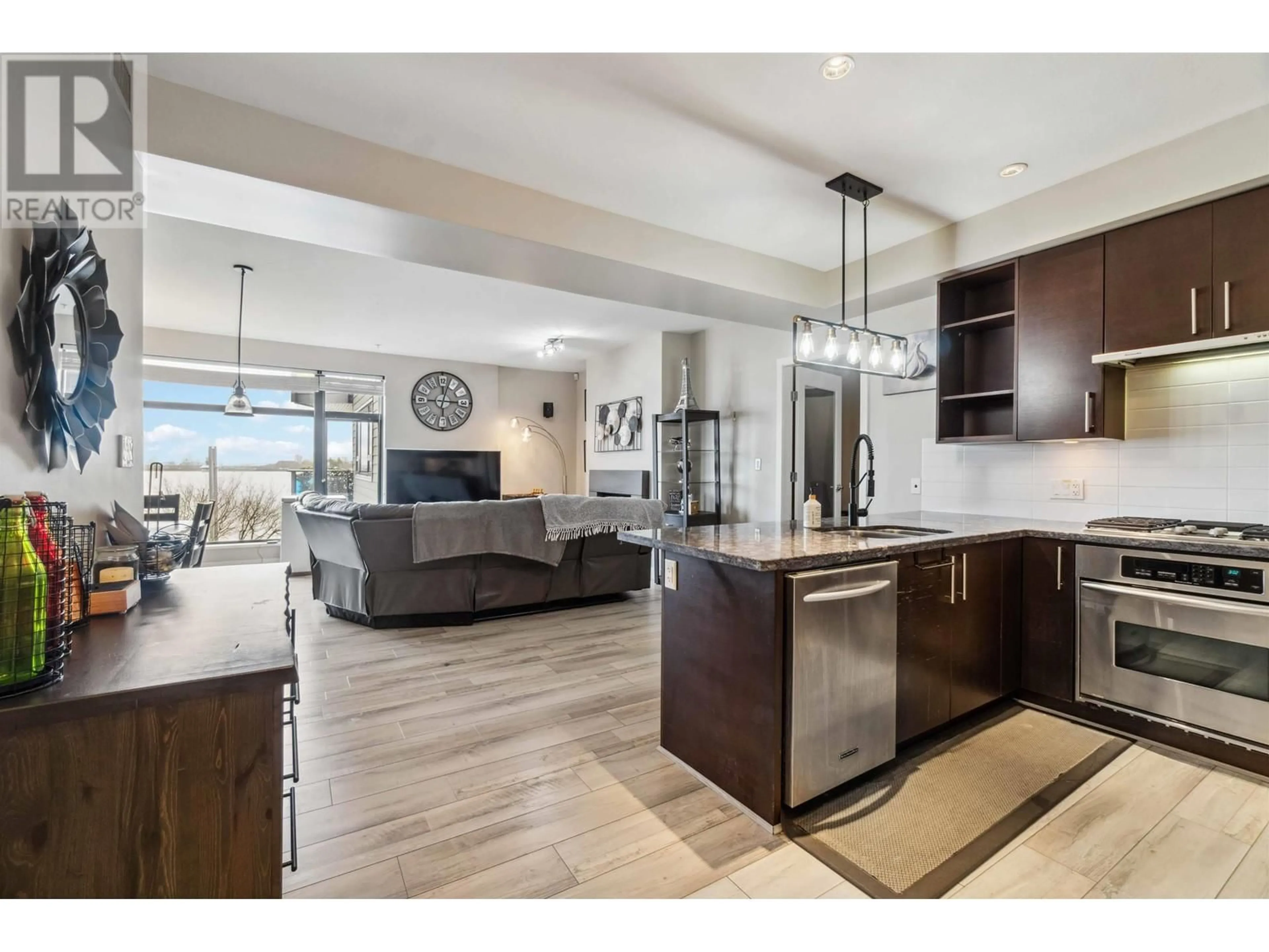 Open concept kitchen, ceramic/tile floor for 201 - 14300 RIVERPORT WAY, Richmond British Columbia V6W0A4