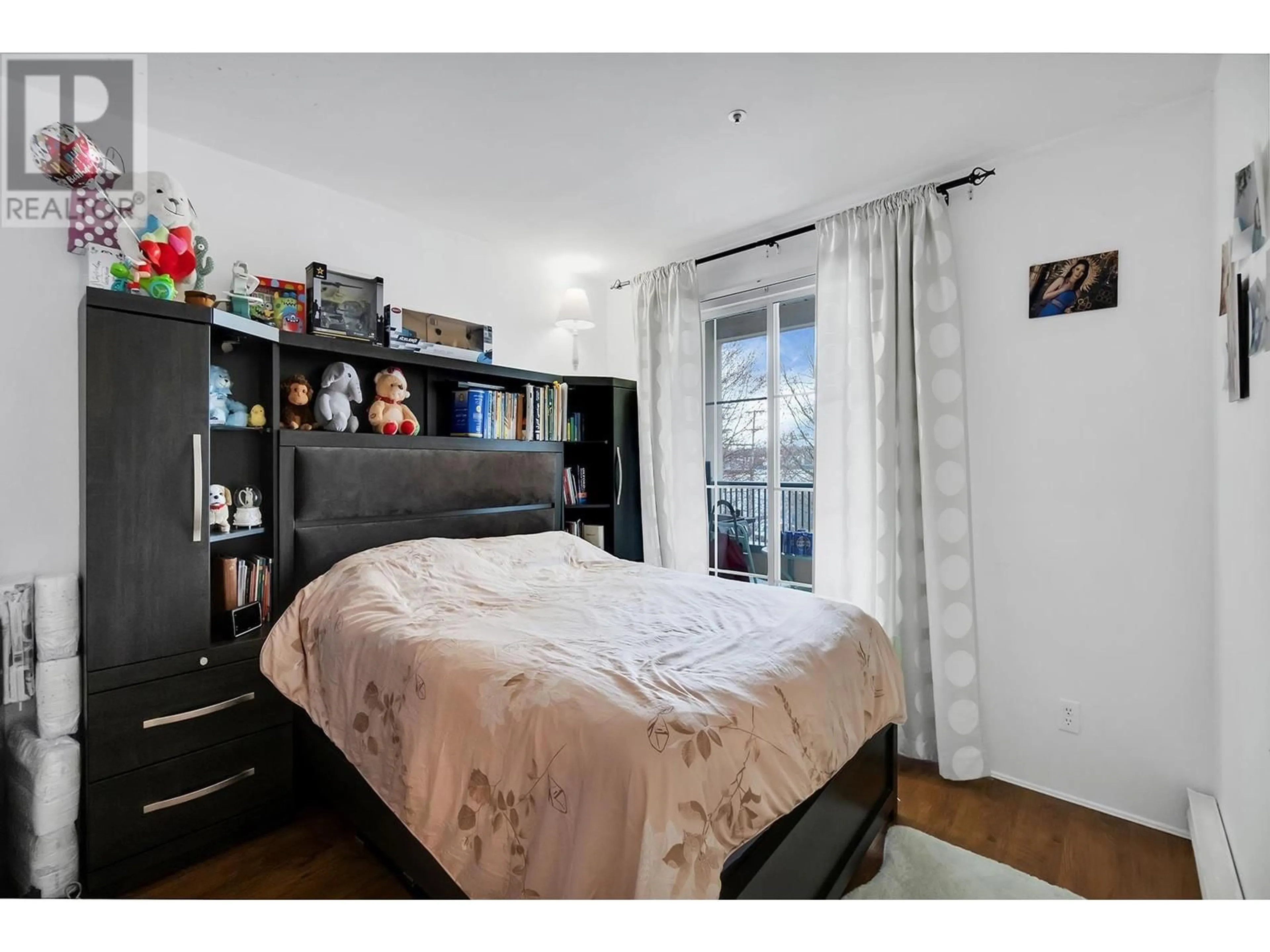 Bedroom with bed, wood/laminate floor for 206 - 295 SCHOOLHOUSE STREET, Coquitlam British Columbia V3K6X5