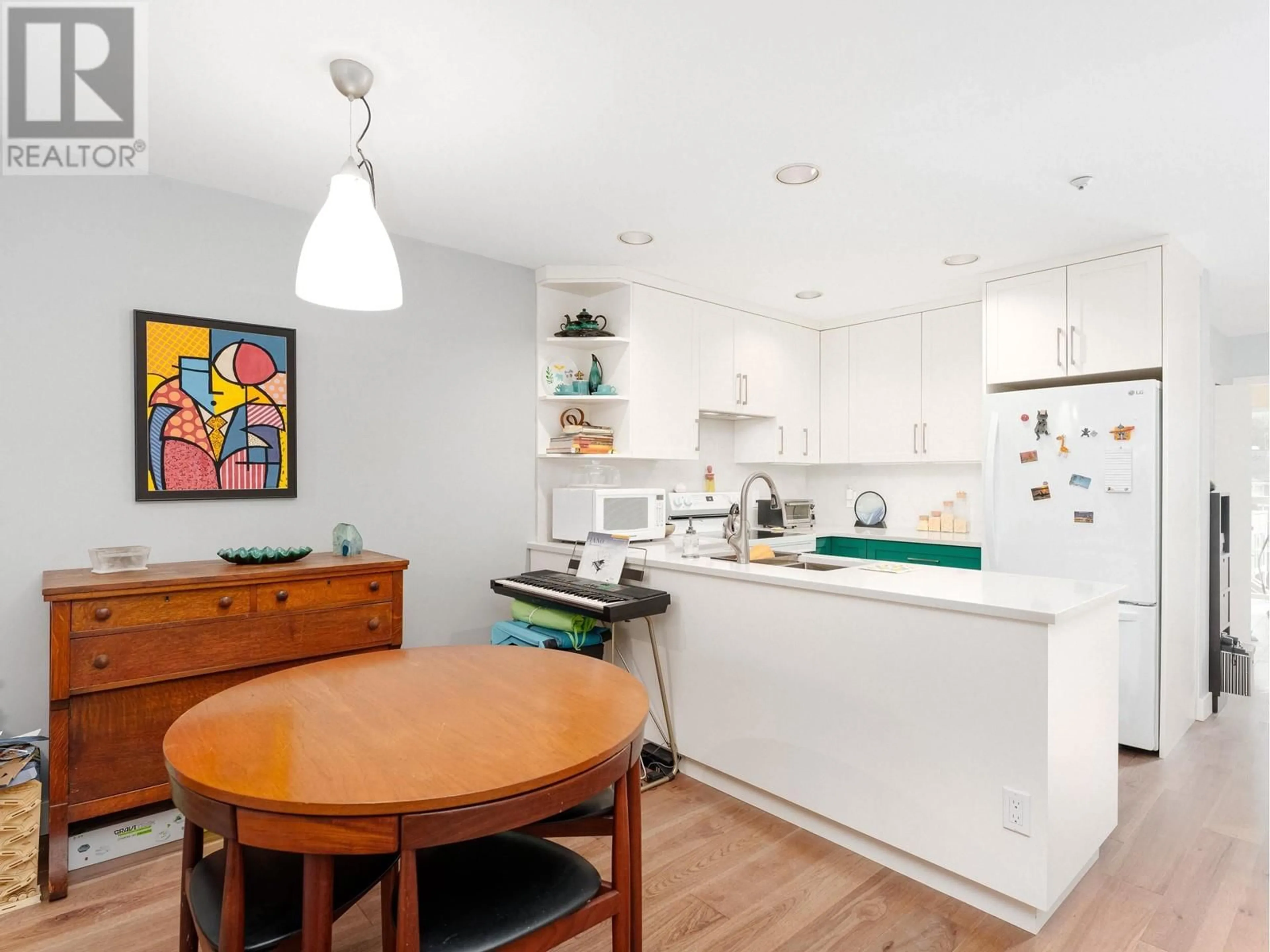 Open concept kitchen, wood/laminate floor for 3375 FIELDSTONE AVENUE, Vancouver British Columbia V5S4R9