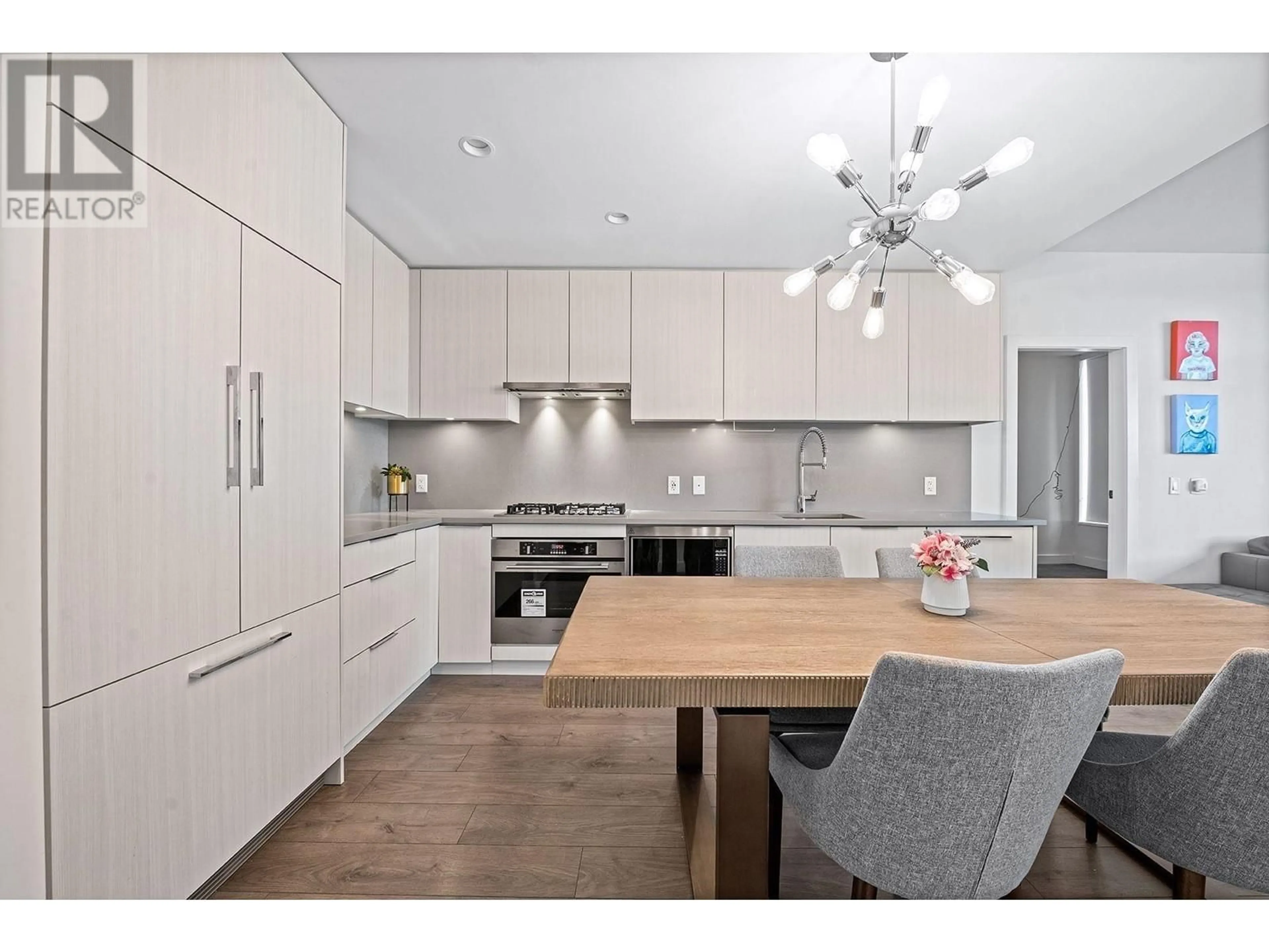 Open concept kitchen, wood/laminate floor for 504 - 4465 JUNEAU STREET, Burnaby British Columbia V5C0L8