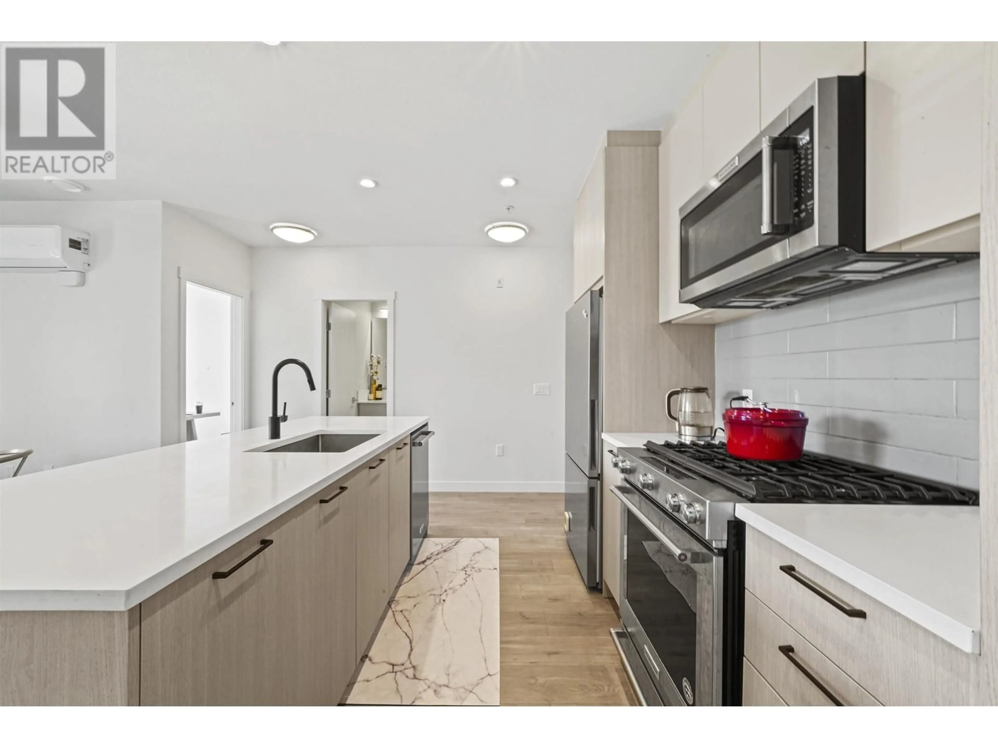 Open concept kitchen, ceramic/tile floor for 305 - 707 COMO LAKE AVENUE, Coquitlam British Columbia V3J0J5
