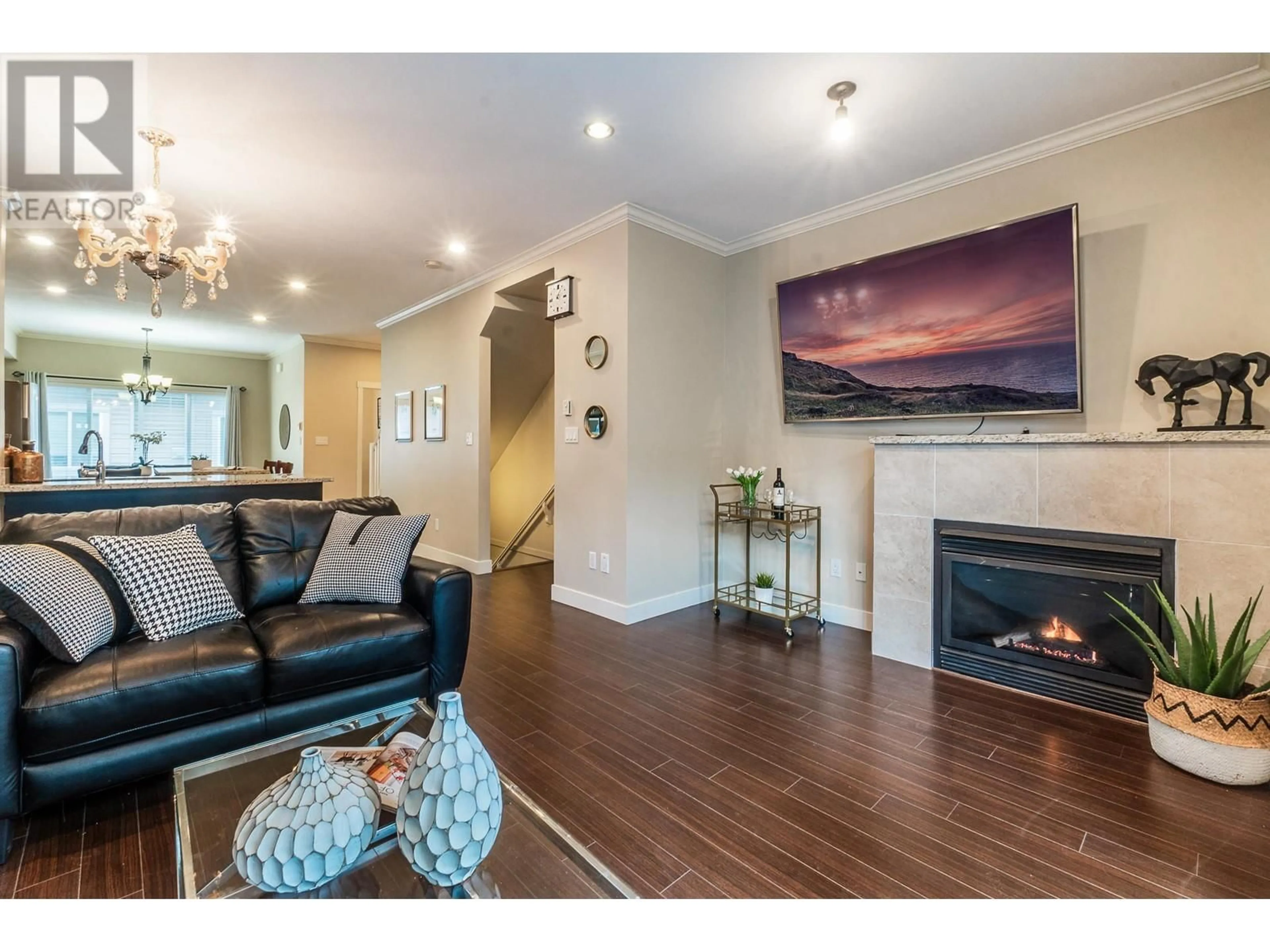Living room with furniture, wood/laminate floor for 31 - 7051 ASH STREET, Richmond British Columbia V6Y2R9