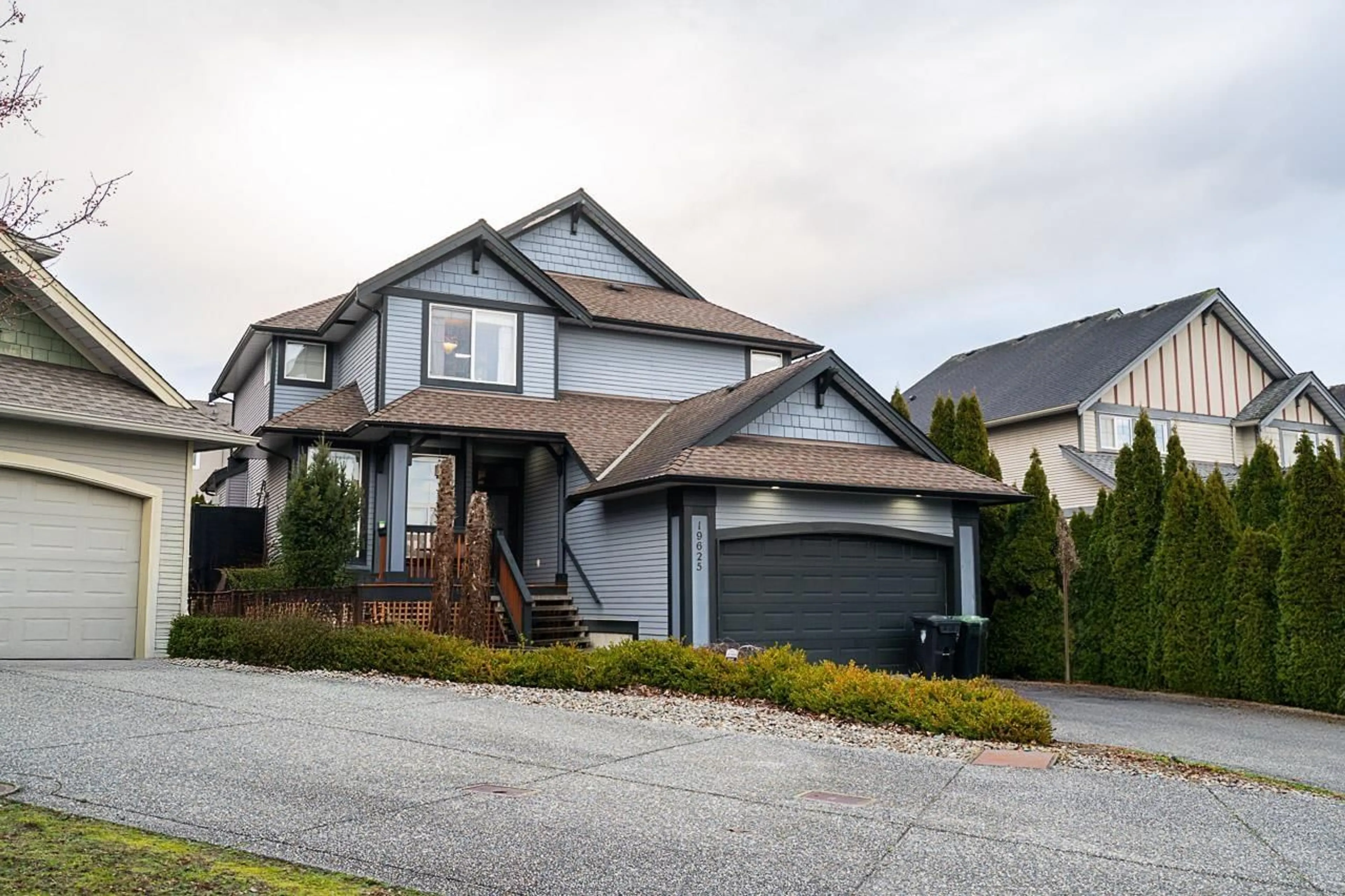 Home with vinyl exterior material, street for 19625 68A, Langley British Columbia V2Y3H2