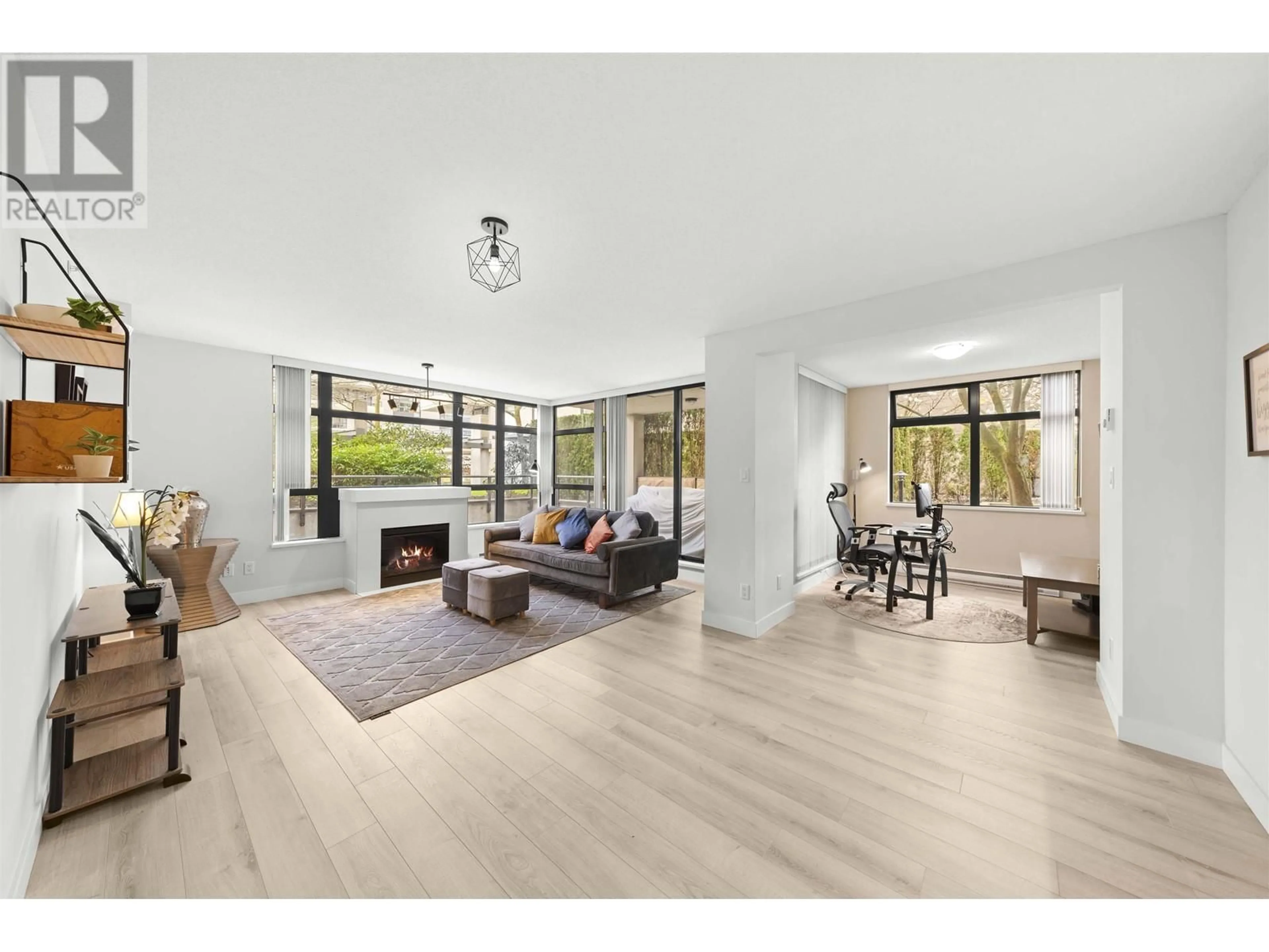 Living room with furniture, wood/laminate floor for 303 - 8180 LANSDOWNE ROAD, Richmond British Columbia V6X0B1