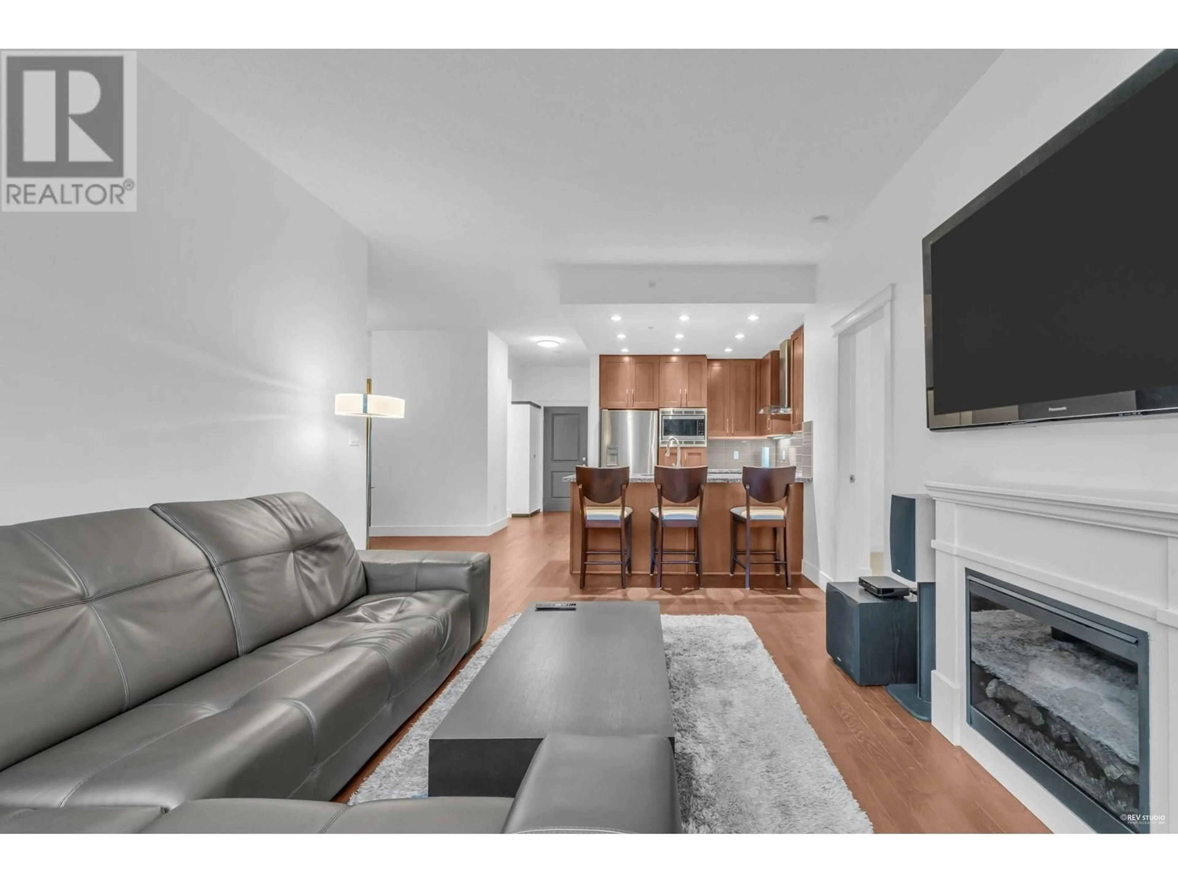 Living room with furniture, wood/laminate floor for 707 - 1415 PARKWAY BOULEVARD, Coquitlam British Columbia V3E0C7