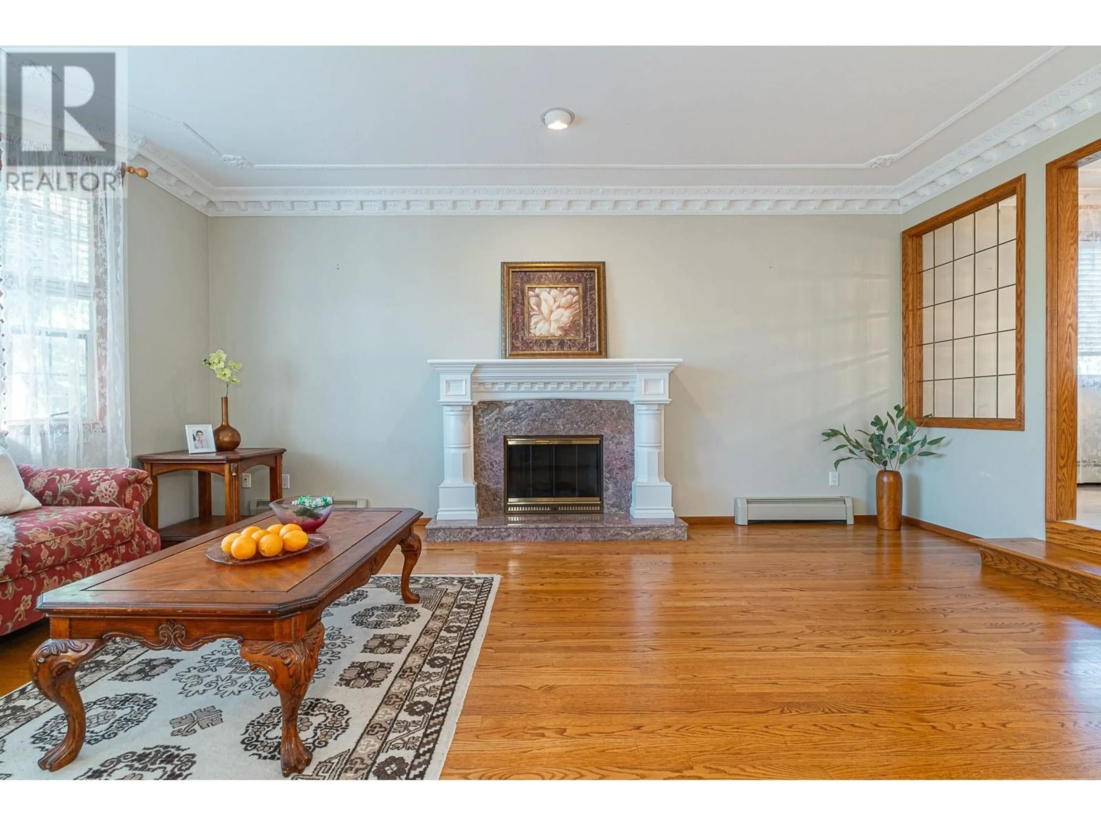 Living room with furniture, wood/laminate floor for 6865 GRANT PLACE, Burnaby British Columbia V5B4X4