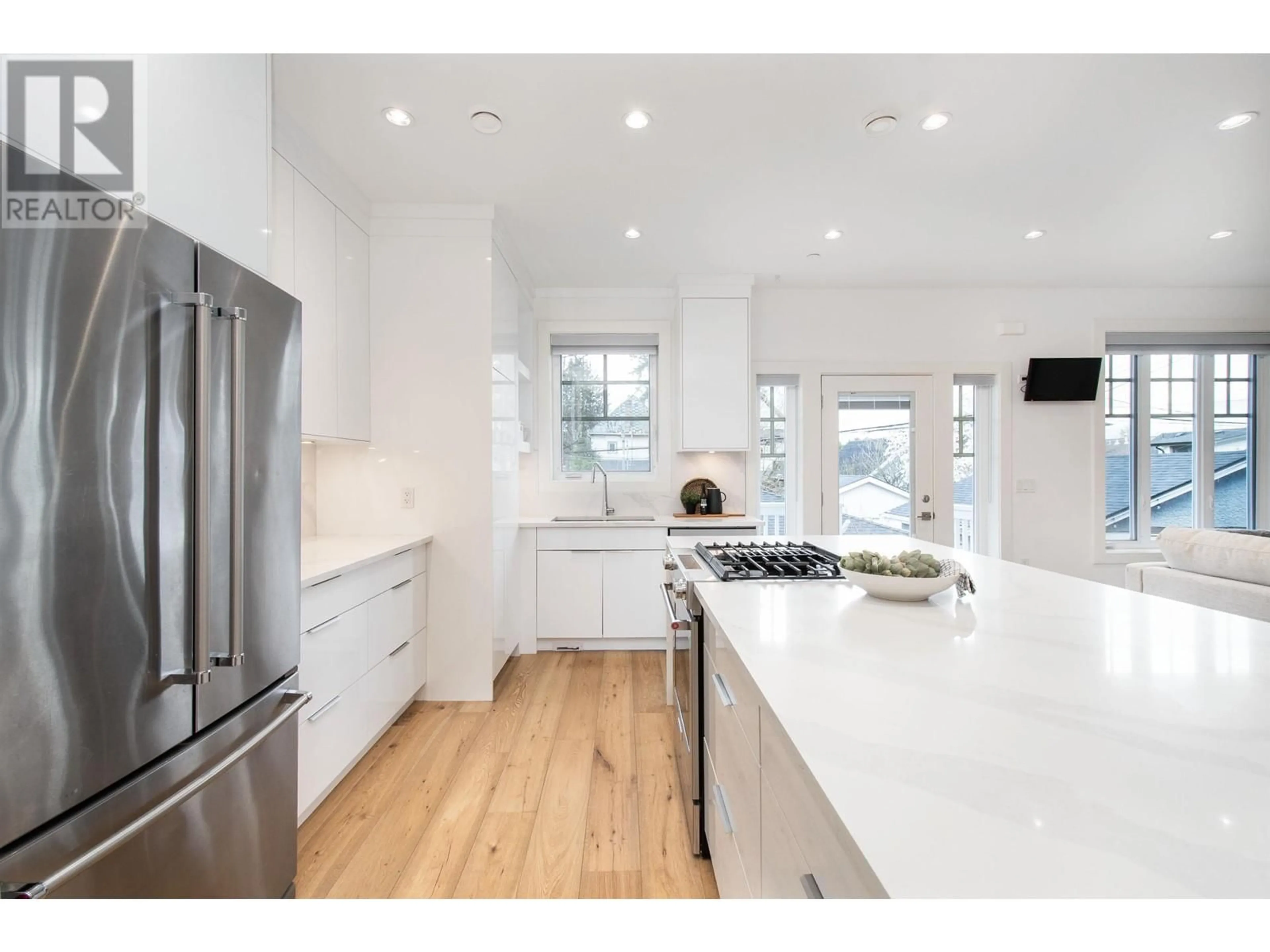 Open concept kitchen, wood/laminate floor for 849 13TH AVENUE, Vancouver British Columbia V5T2L4