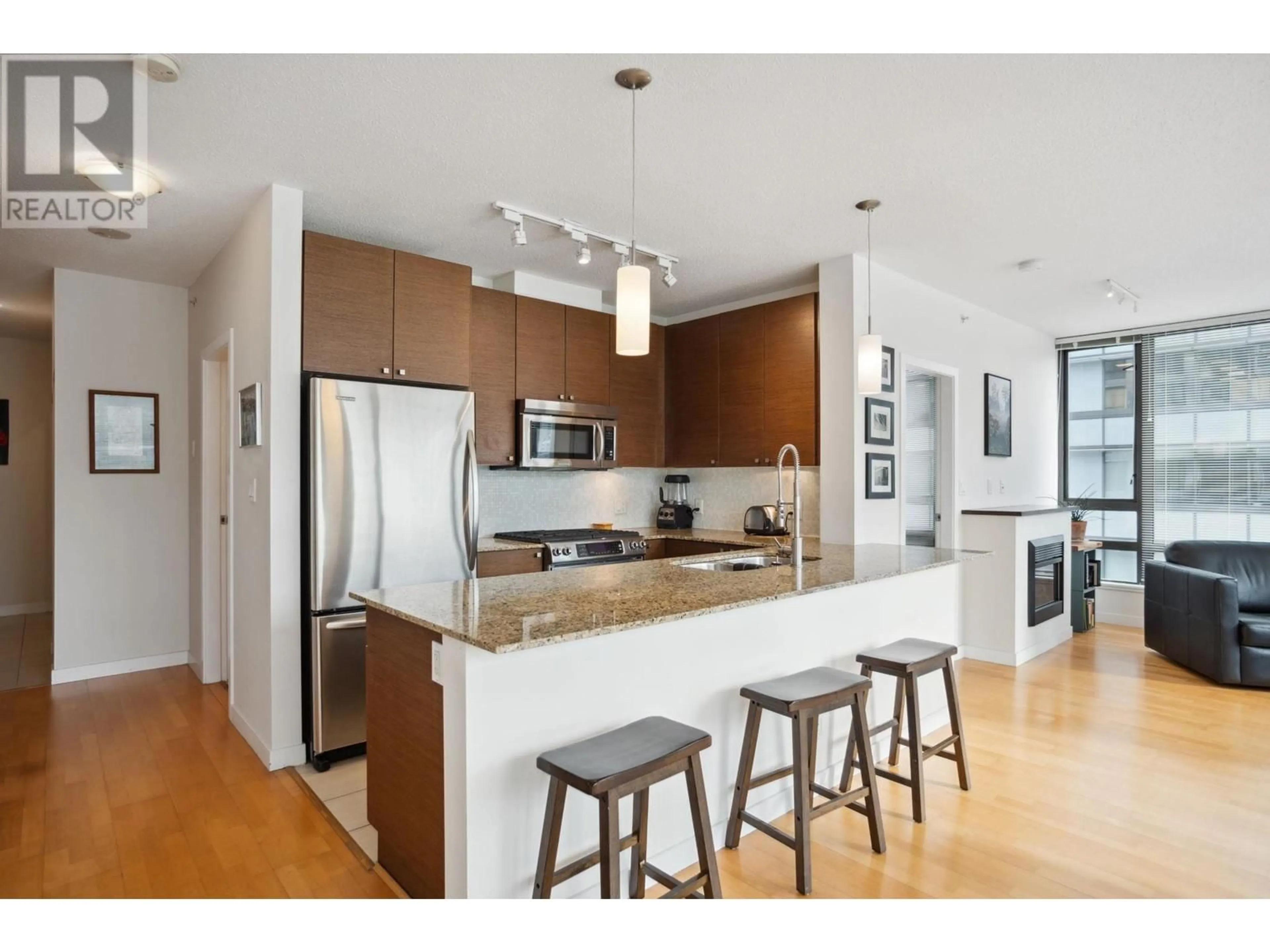 Open concept kitchen, wood/laminate floor for 402 - 400 CAPILANO ROAD, Port Moody British Columbia V3H0E1