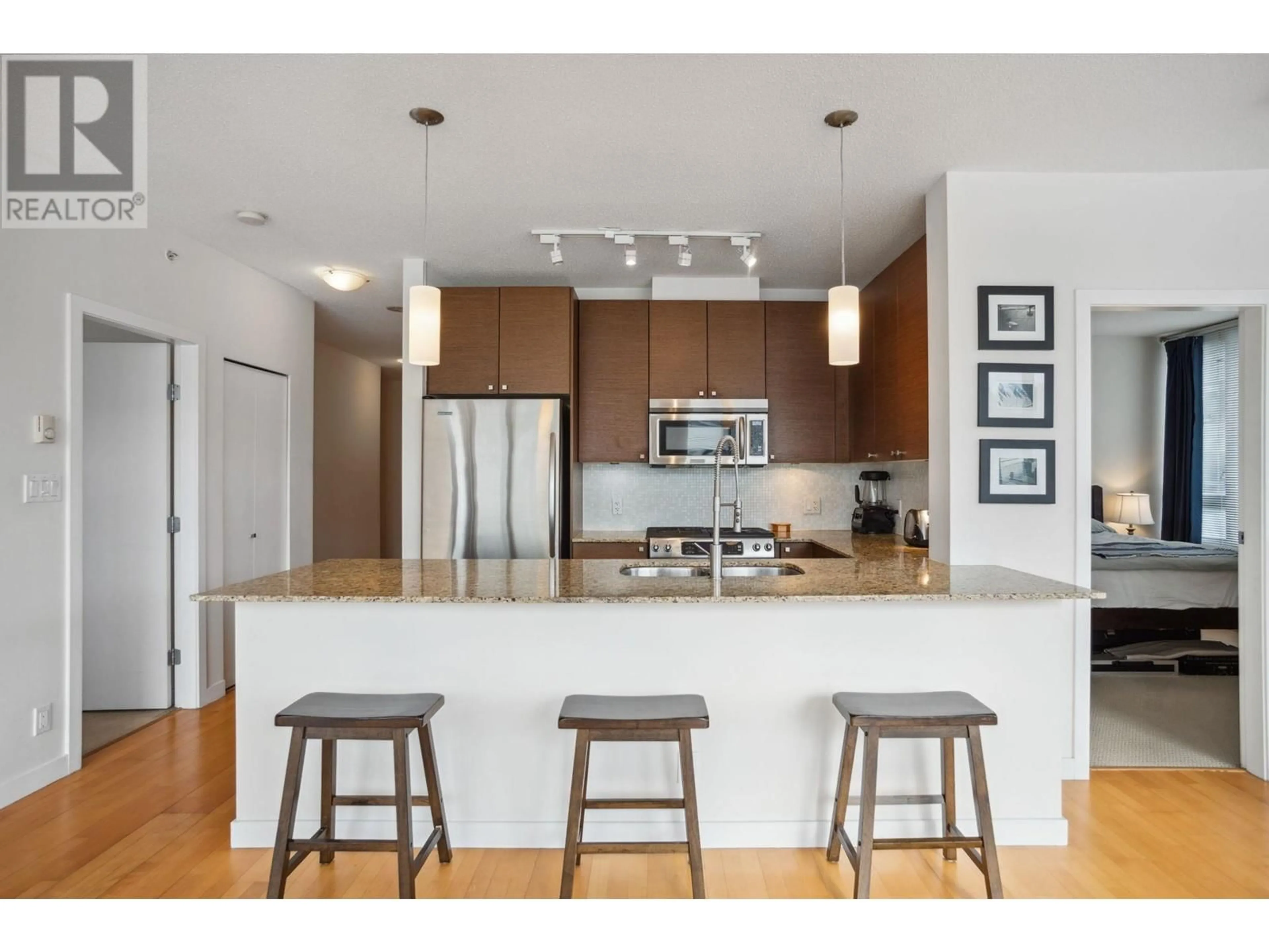 Open concept kitchen, wood/laminate floor for 402 - 400 CAPILANO ROAD, Port Moody British Columbia V3H0E1