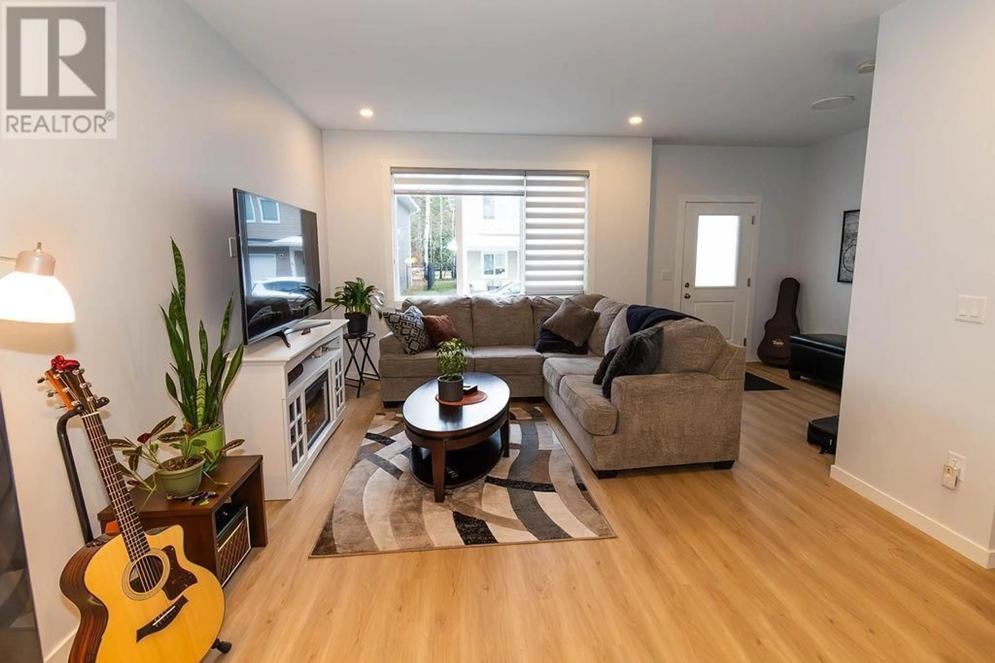 Living room with furniture, wood/laminate floor for 4 - 4921 HALLIWELL AVENUE, Terrace British Columbia V8G2J7