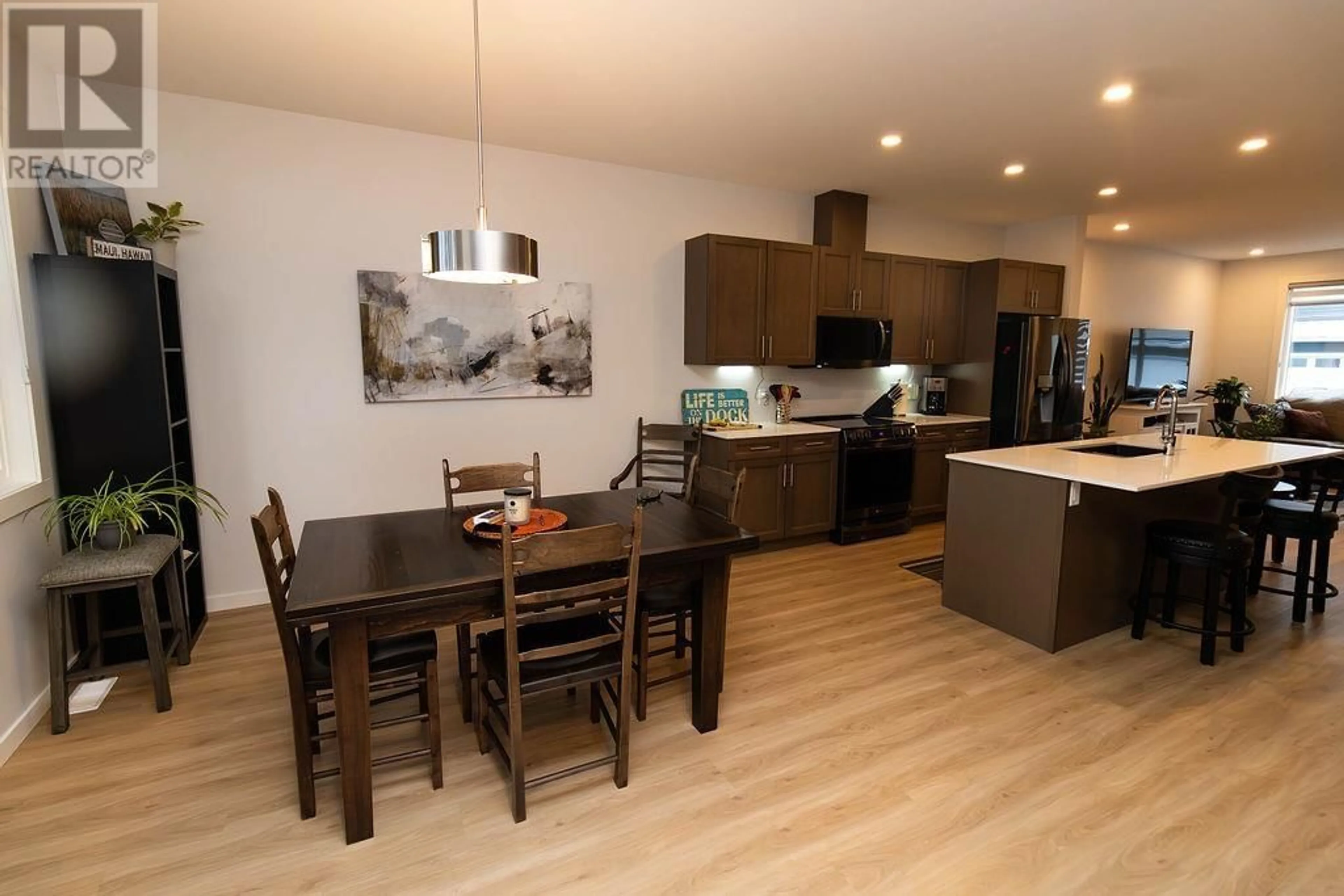 Open concept kitchen, wood/laminate floor for 4 - 4921 HALLIWELL AVENUE, Terrace British Columbia V8G2J7