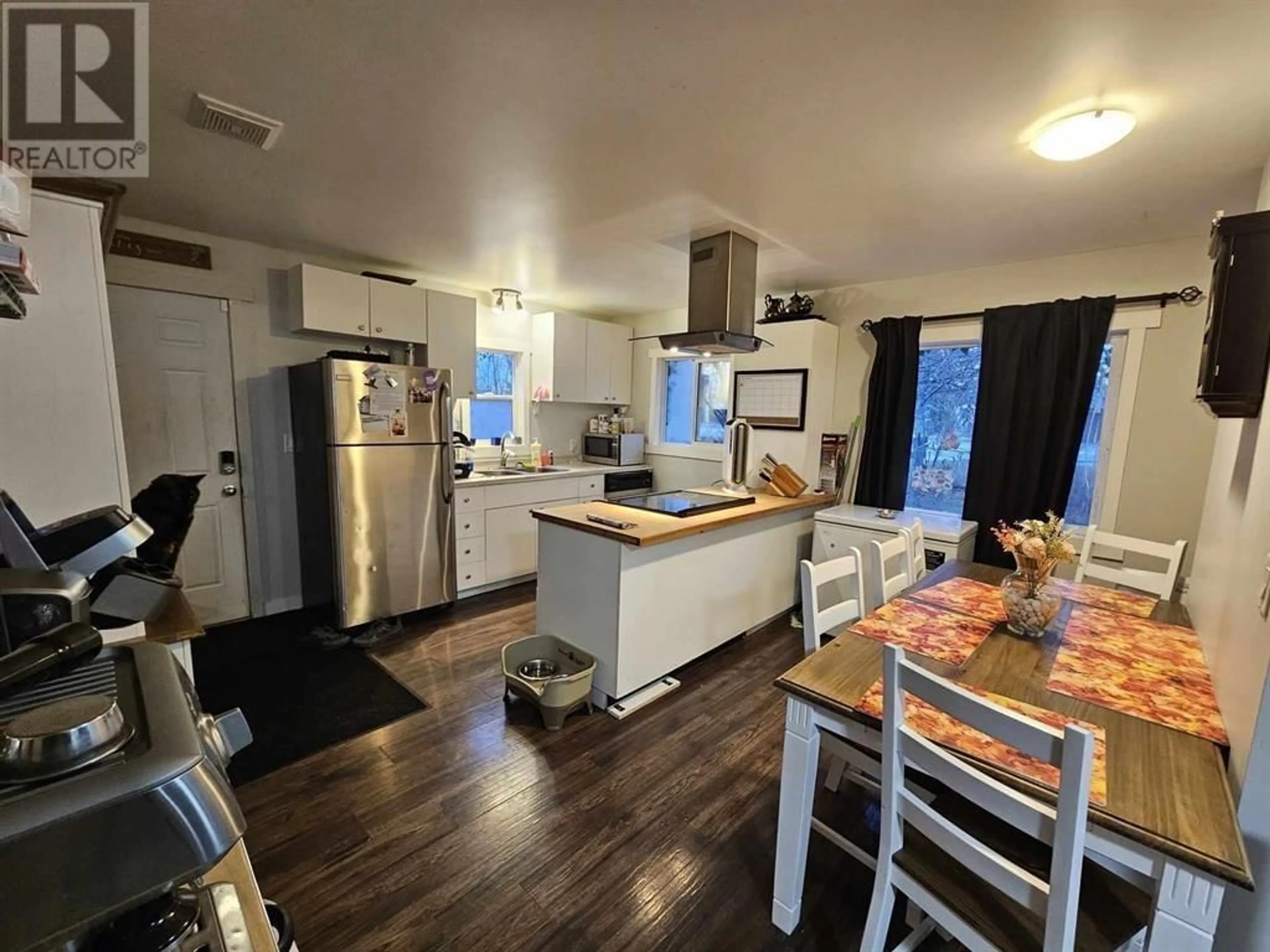 Open concept kitchen, wood/laminate floor for 718 NORTH NECHAKO ROAD, Prince George British Columbia V2K1A1