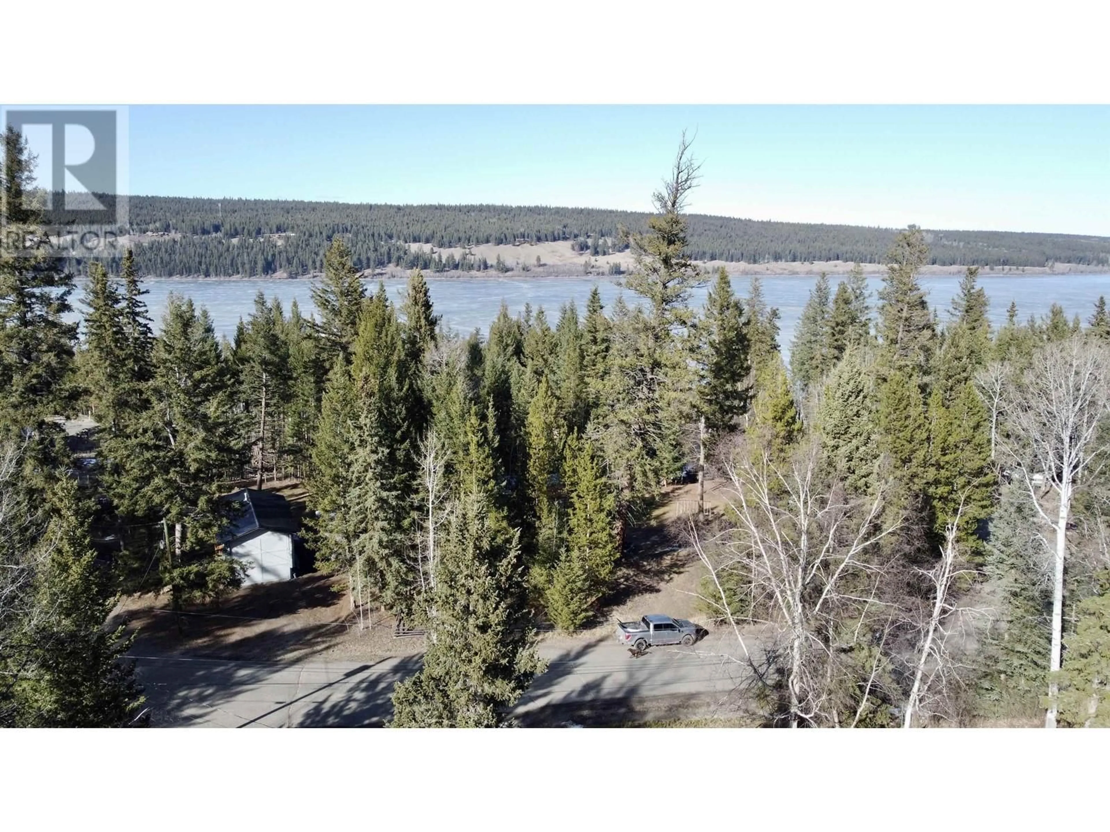A pic from outside/outdoor area/front of a property/back of a property/a pic from drone, water/lake/river/ocean view for 6479 EWEN ROAD, Horse Lake British Columbia V0K2E3