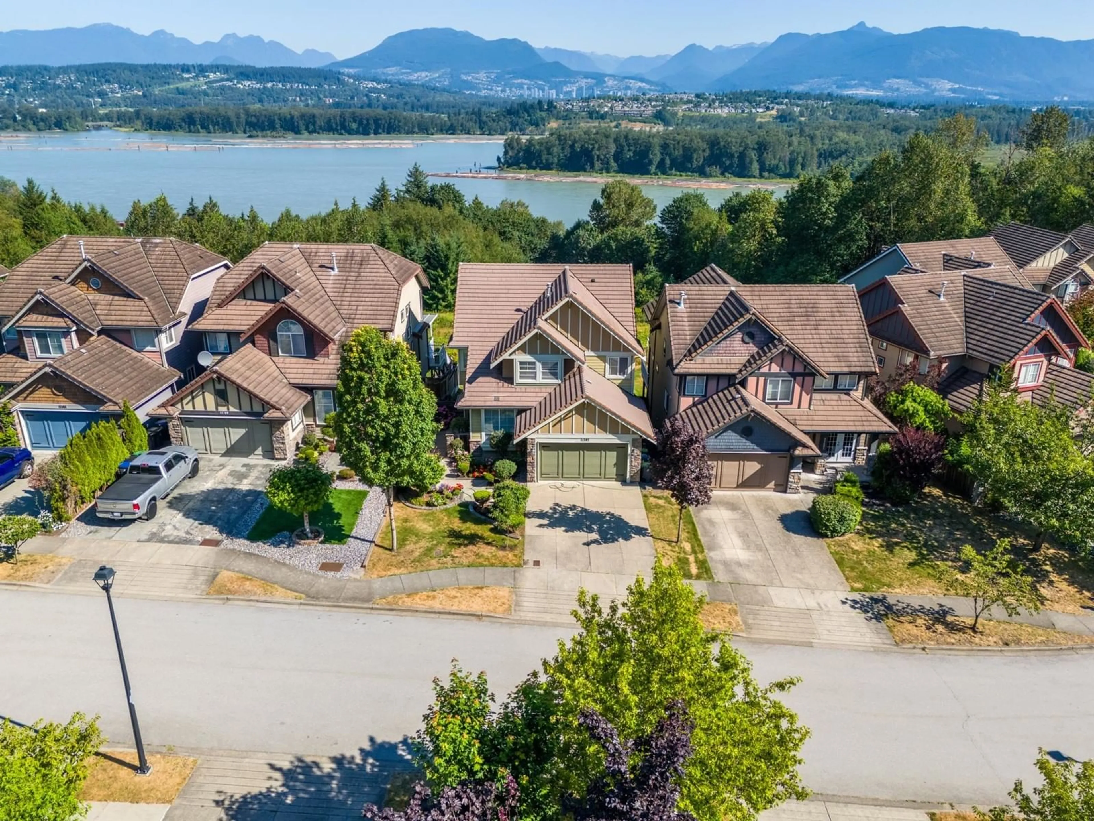 A pic from outside/outdoor area/front of a property/back of a property/a pic from drone, water/lake/river/ocean view for 11397 154A, Surrey British Columbia V3R2V7