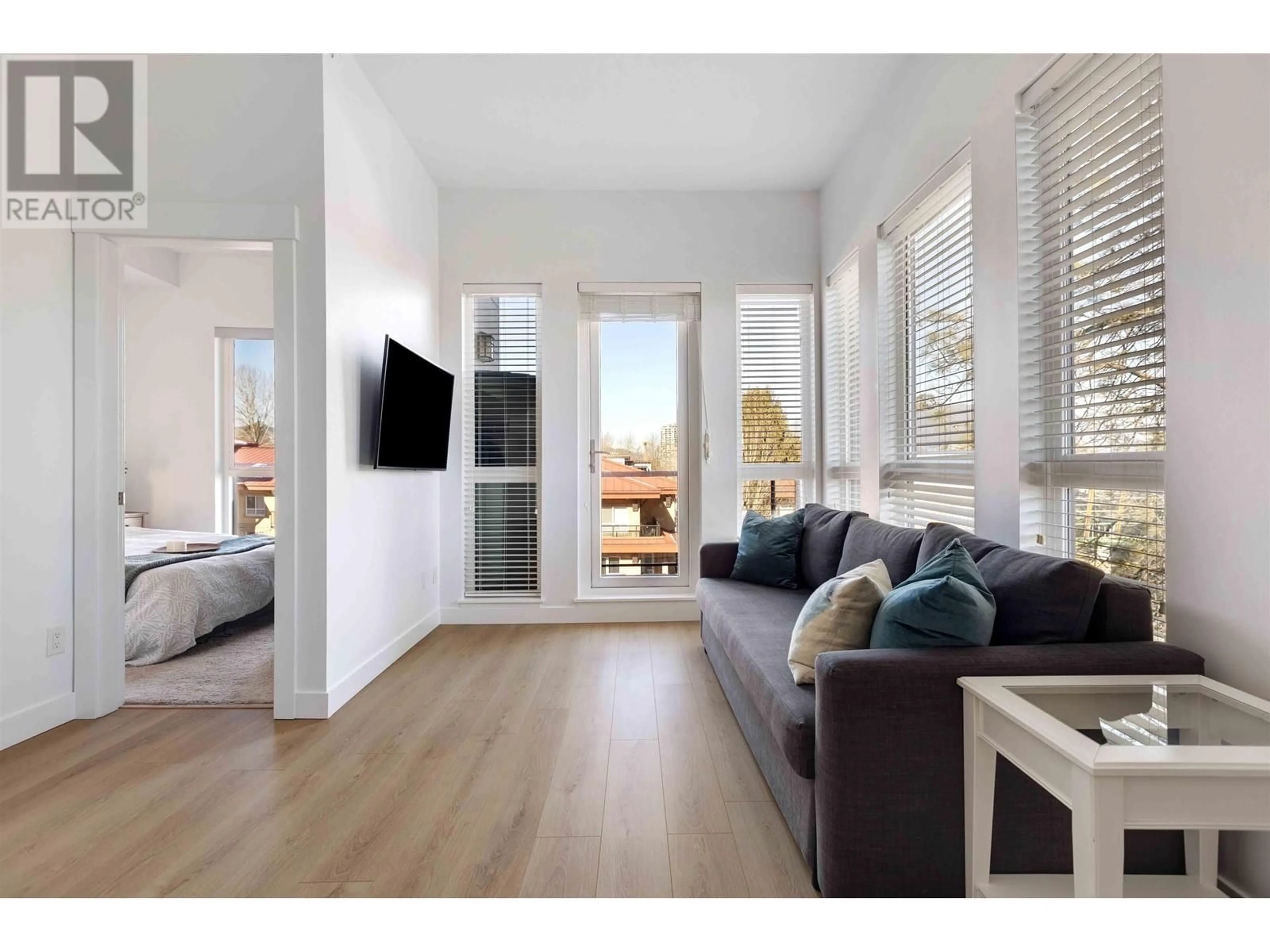 Living room with furniture, wood/laminate floor for 505 - 2214 KELLY AVENUE, Port Coquitlam British Columbia V3C0E5