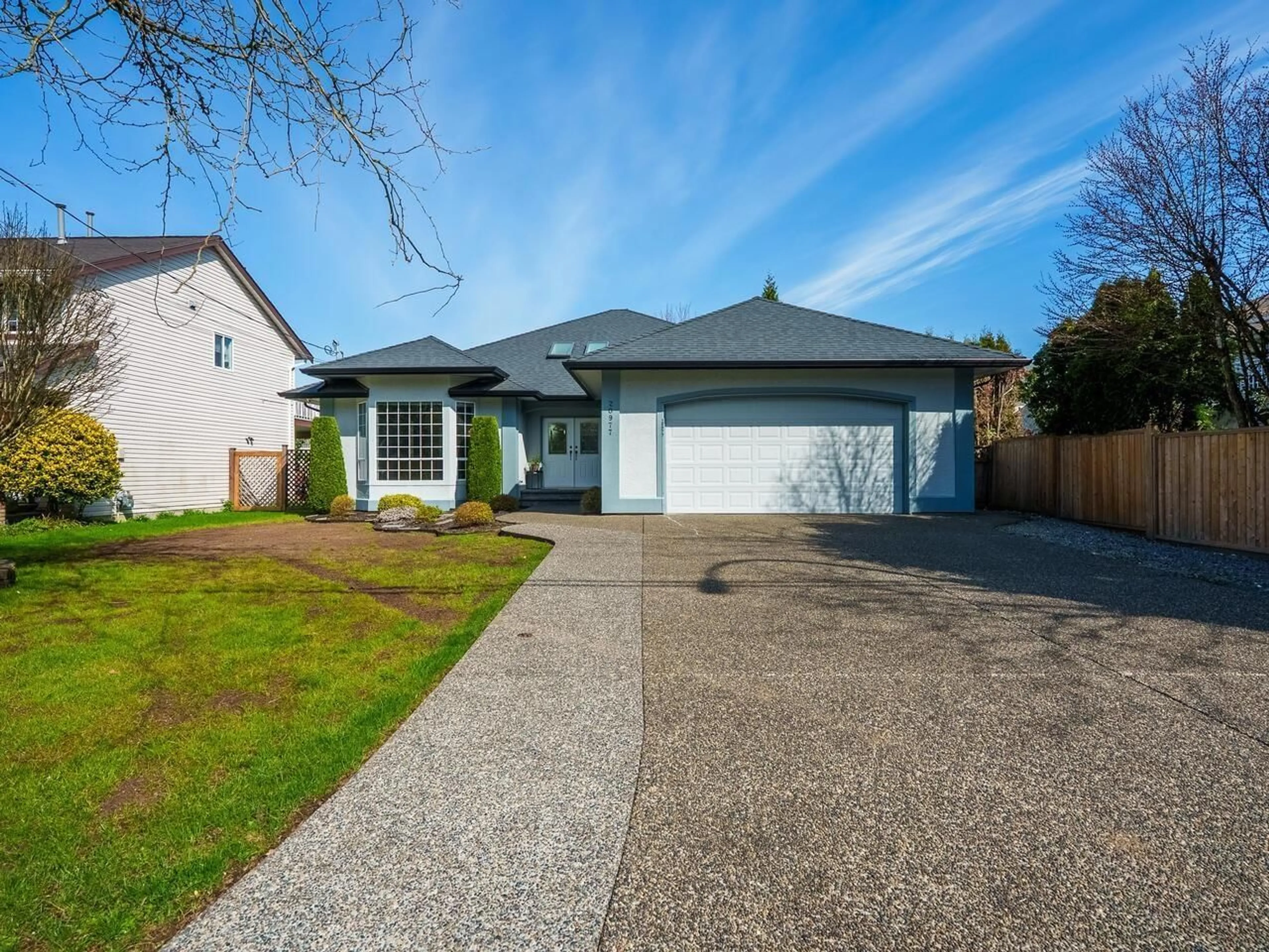 Home with vinyl exterior material, street for 20977 44, Langley British Columbia V3A5A9