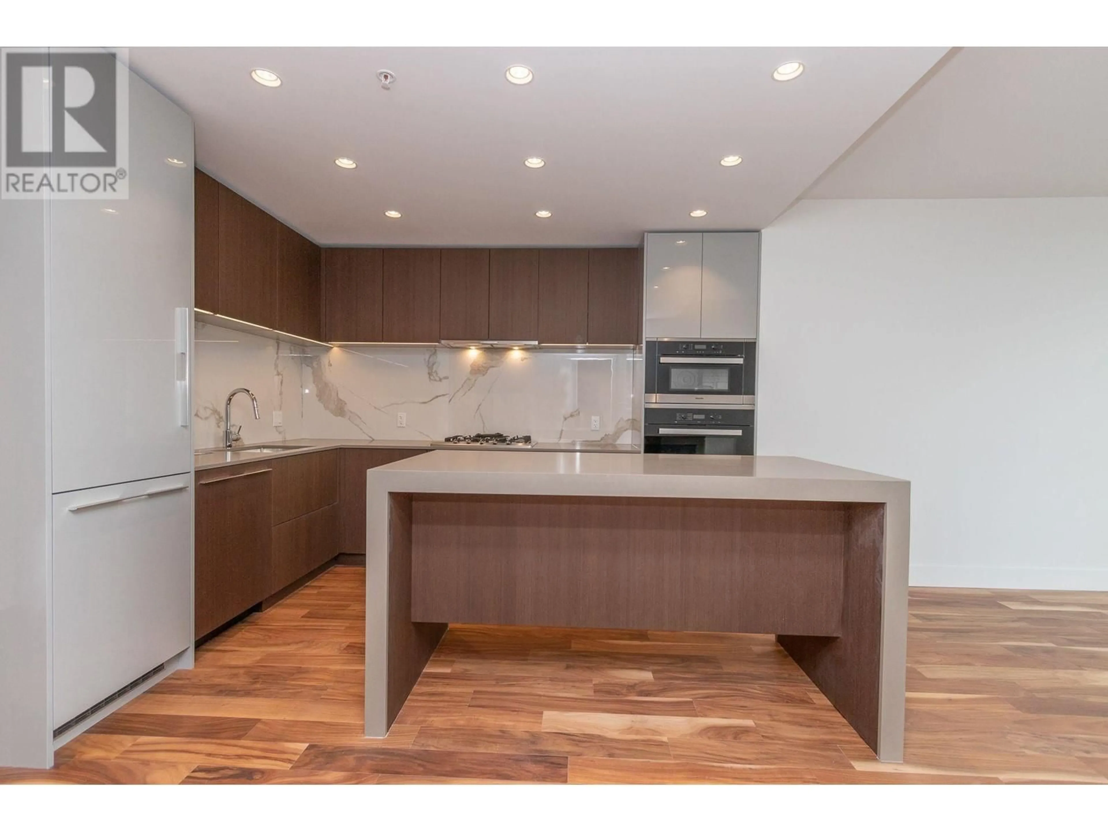 Open concept kitchen, wood/laminate floor for 605 - 1675 LIONS GATE LANE, North Vancouver British Columbia V7P3B4