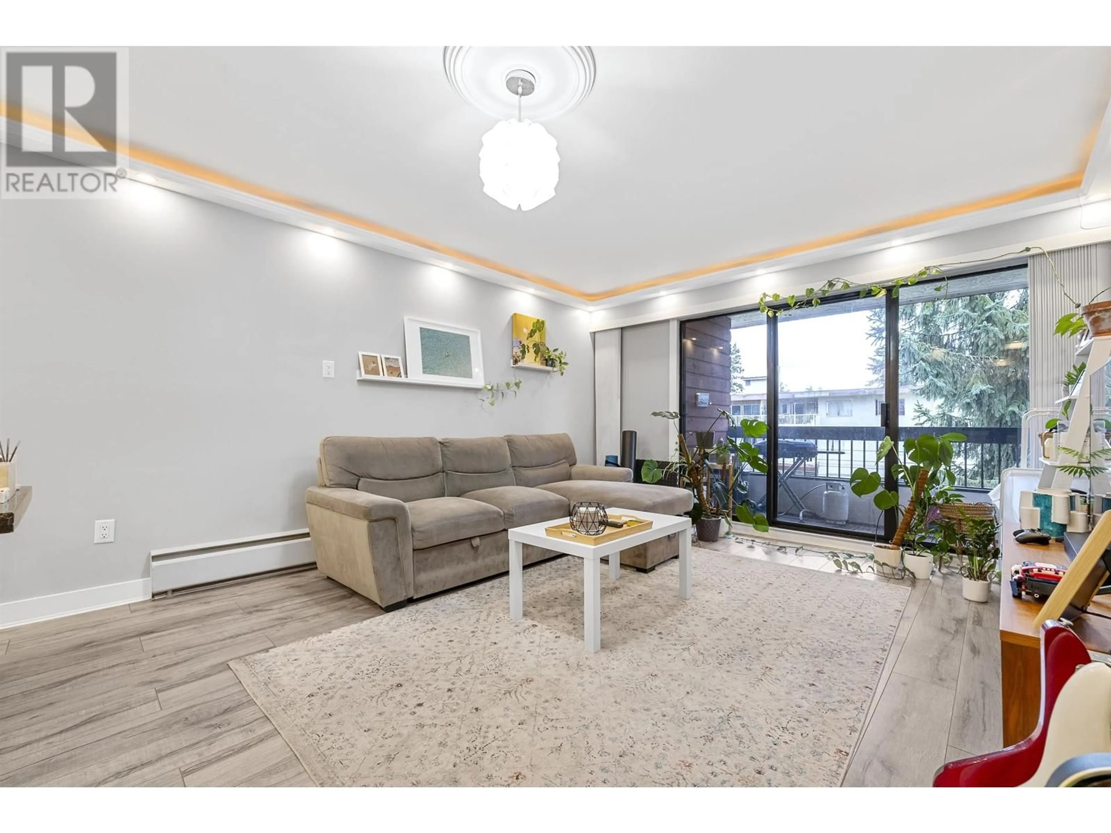 Living room with furniture, wood/laminate floor for 306 - 7180 LINDEN AVENUE, Burnaby British Columbia V5E3G6