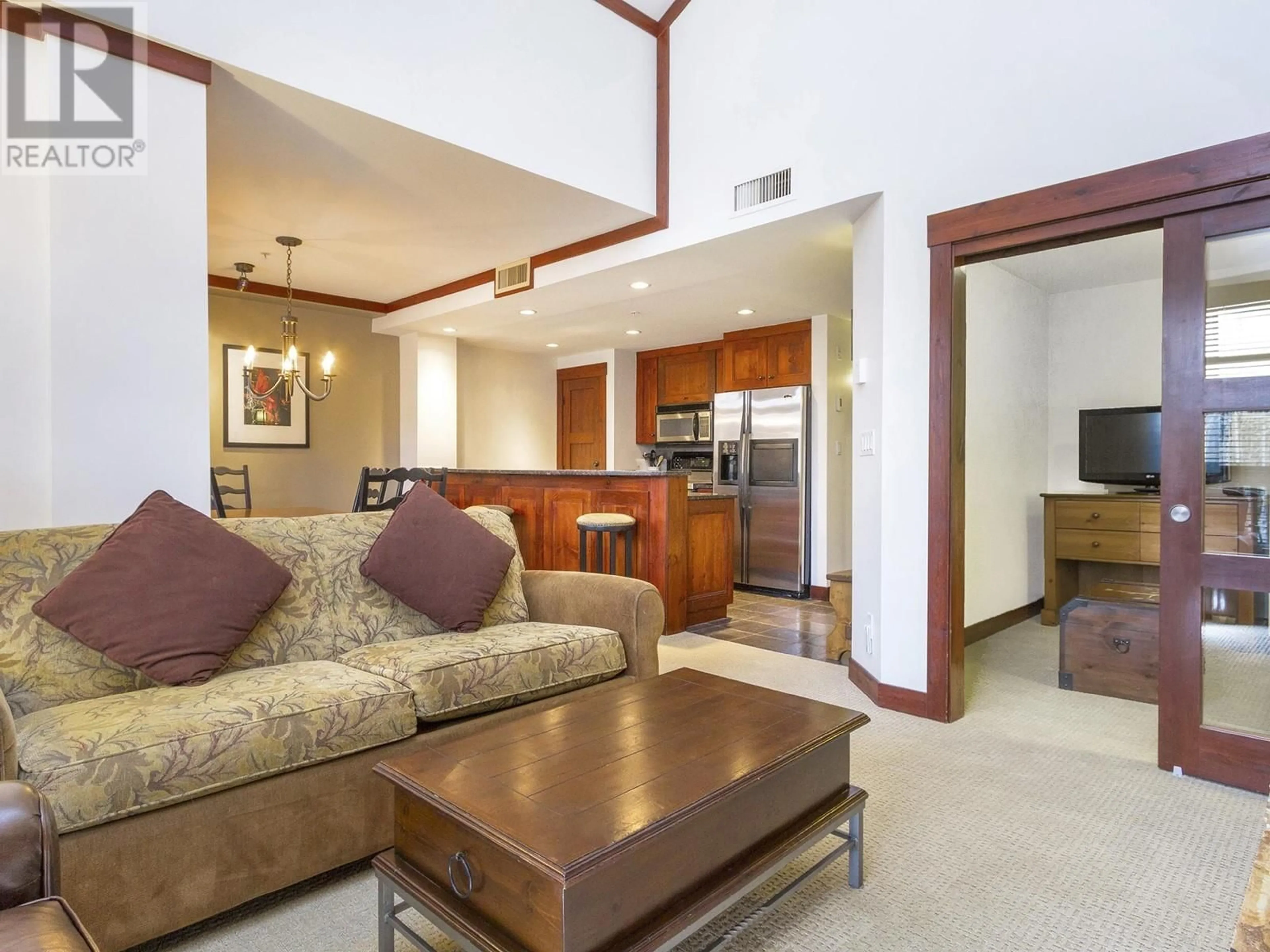 Living room with furniture, unknown for 208 - 2202 GONDOLA WAY, Whistler British Columbia V8E0M7