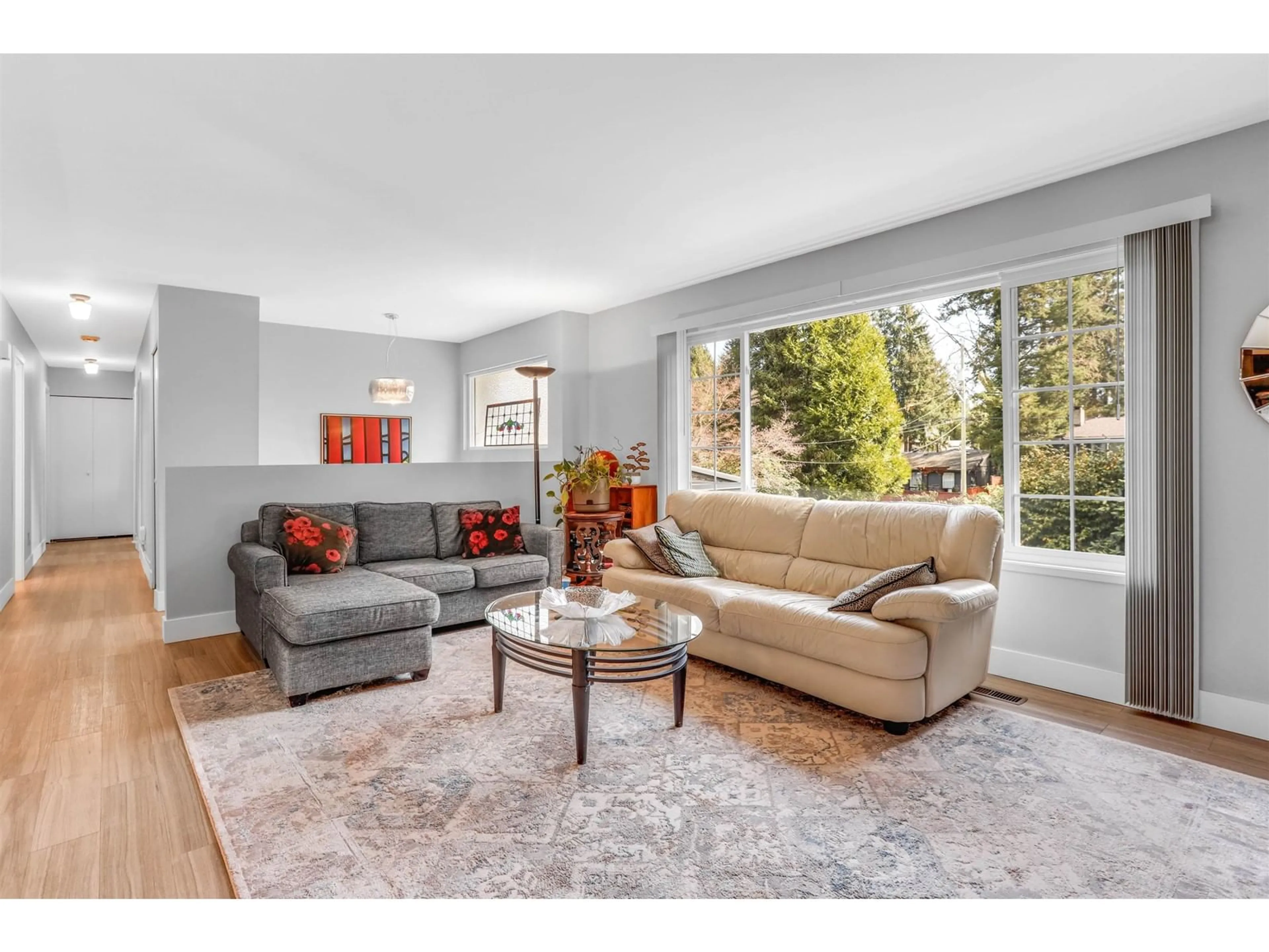 Living room with furniture, wood/laminate floor for 3943 202A, Langley British Columbia V3A1T3