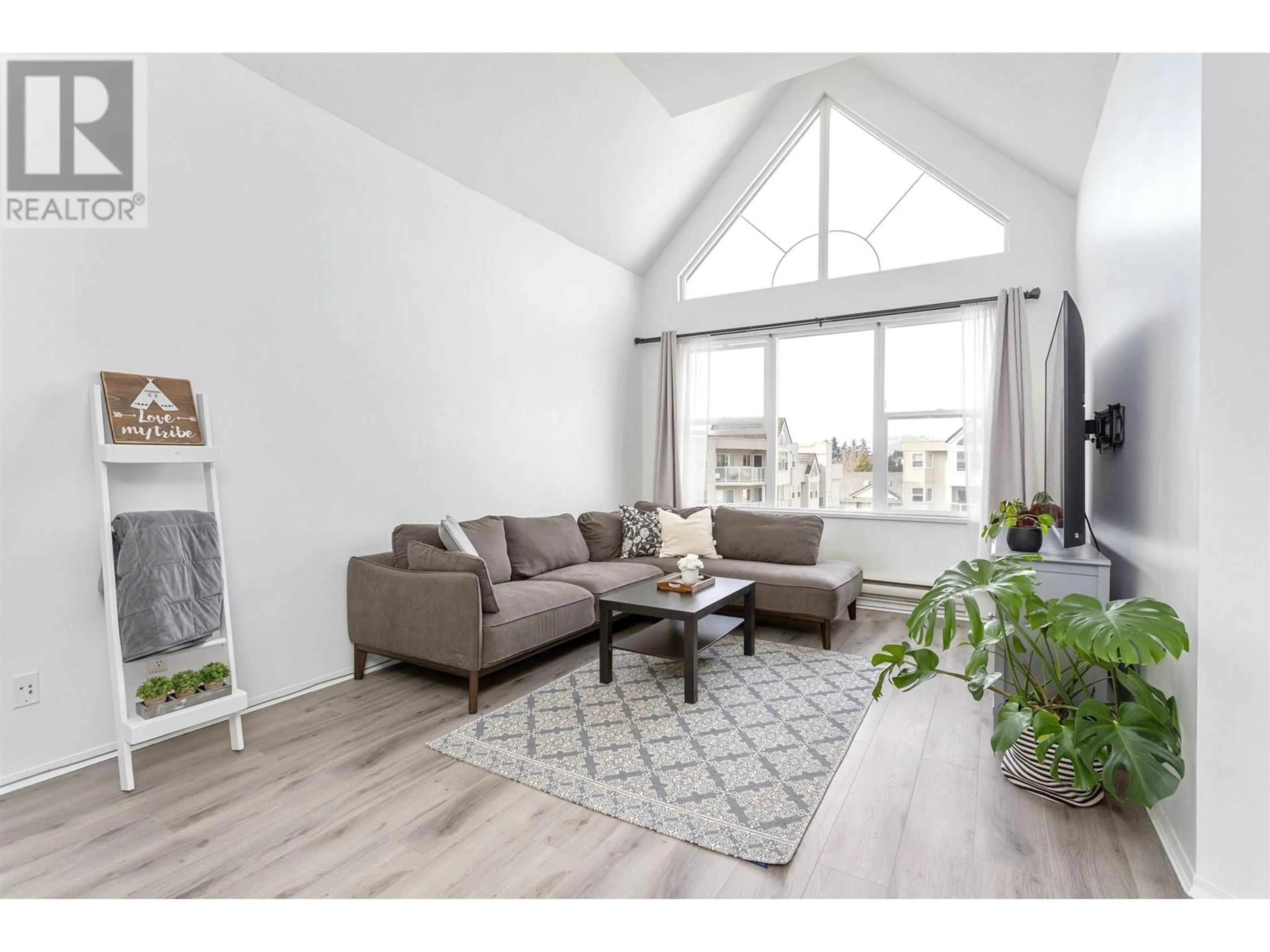 Living room with furniture, wood/laminate floor for 405 - 7051 BLUNDELL ROAD, Richmond British Columbia V6Y1J5