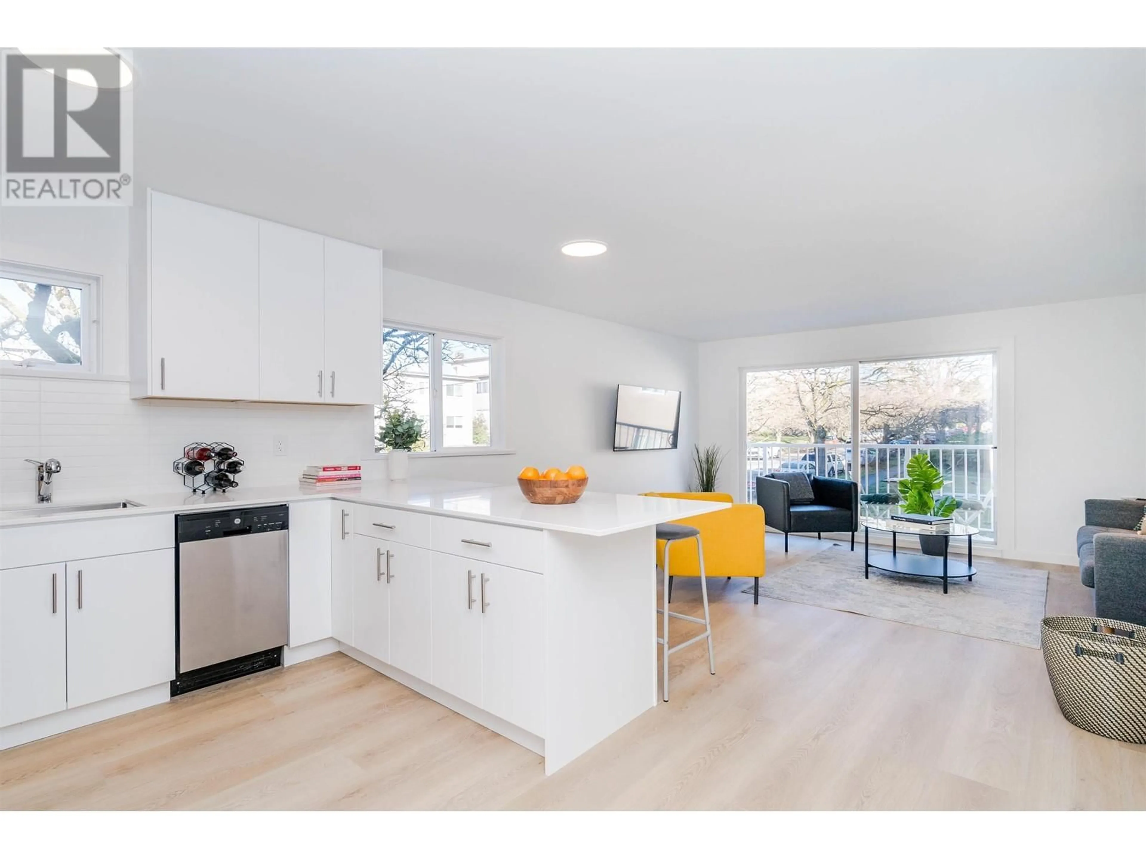 Open concept kitchen, wood/laminate floor for 201 - 8690 MONTCALM STREET, Vancouver British Columbia V6P4P8