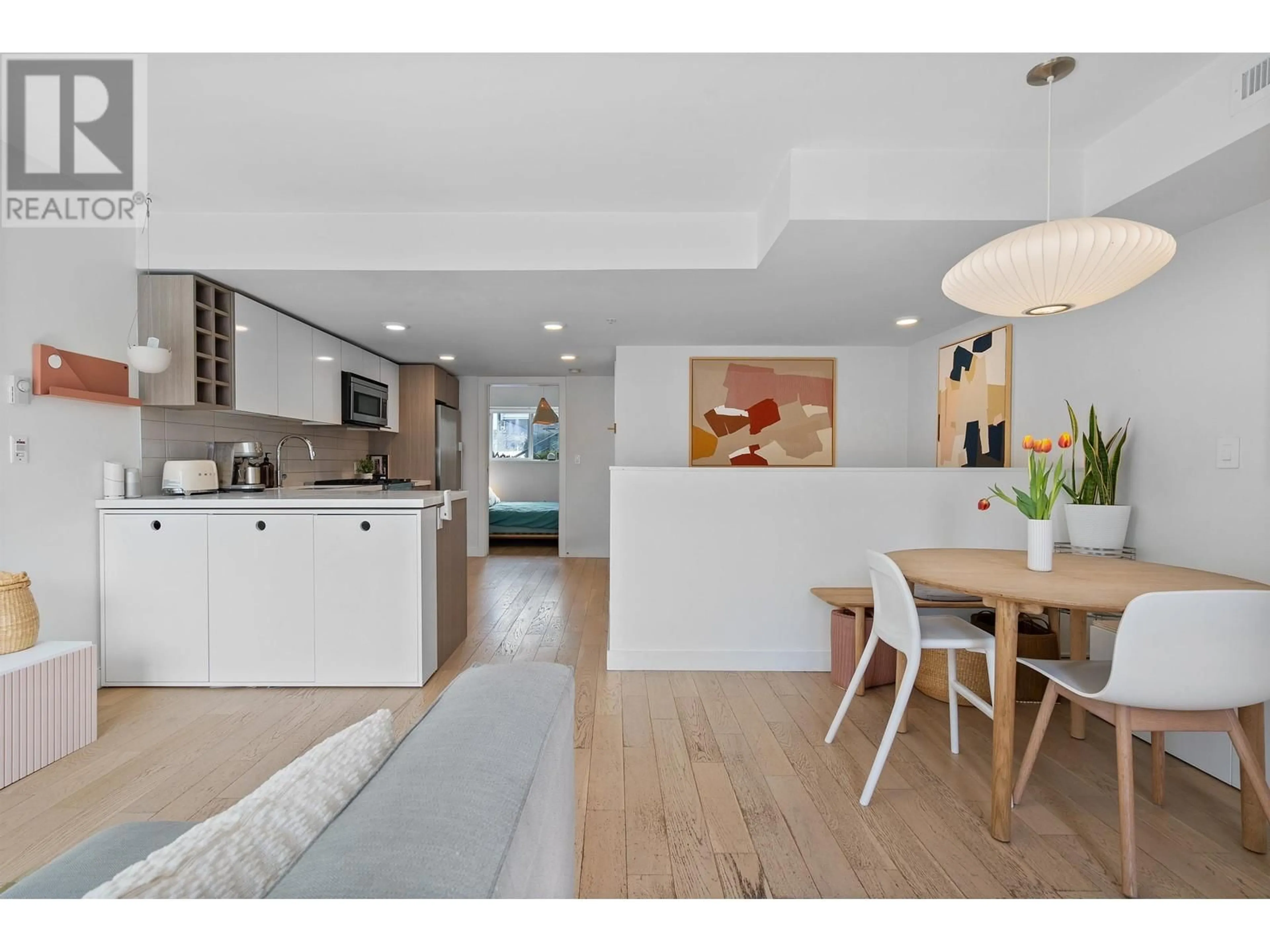 Open concept kitchen, wood/laminate floor for 355 16TH AVENUE, Vancouver British Columbia V5T2T7