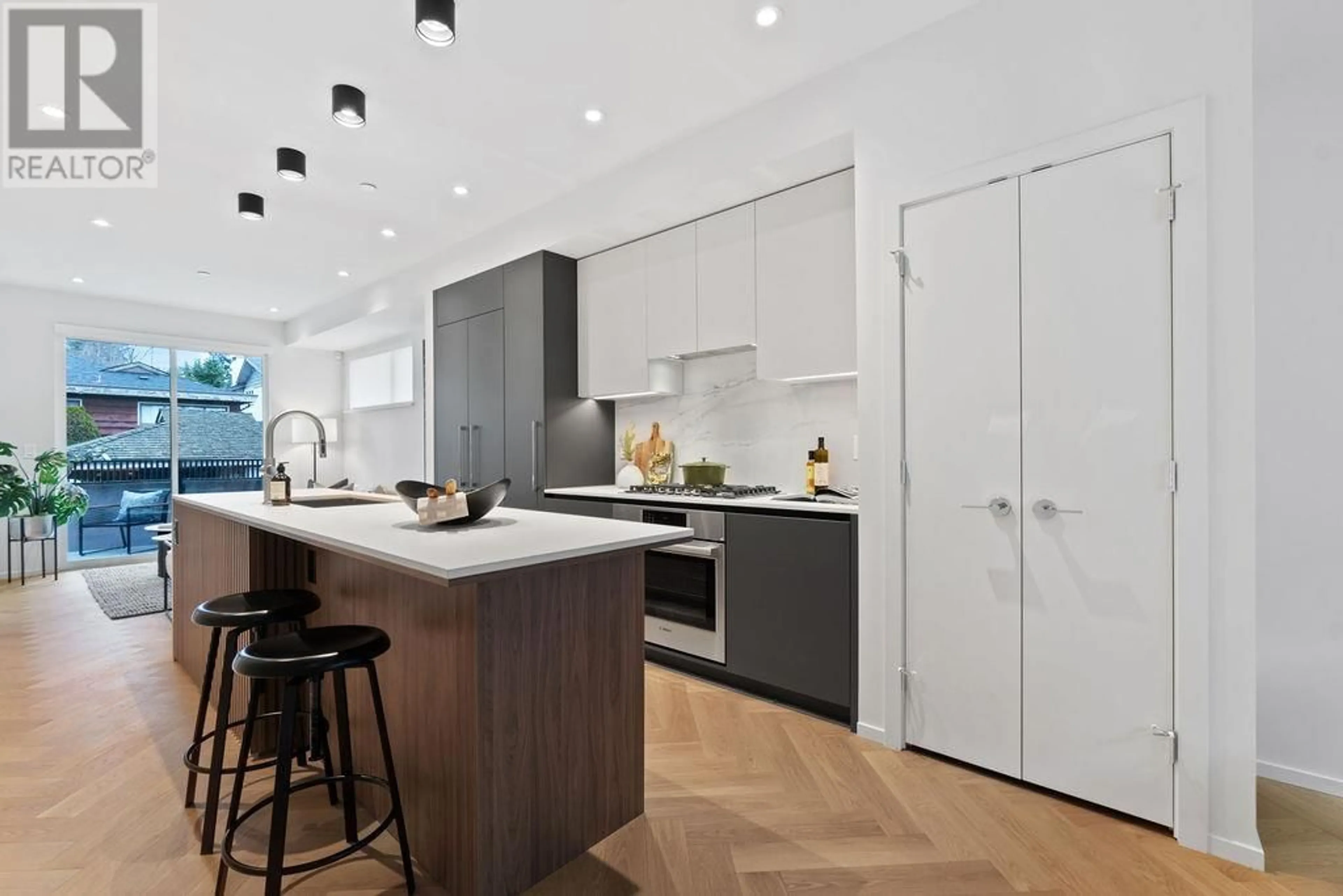 Contemporary kitchen, wood/laminate floor for 121 - 755 49TH AVENUE, Vancouver British Columbia V5Z2S6