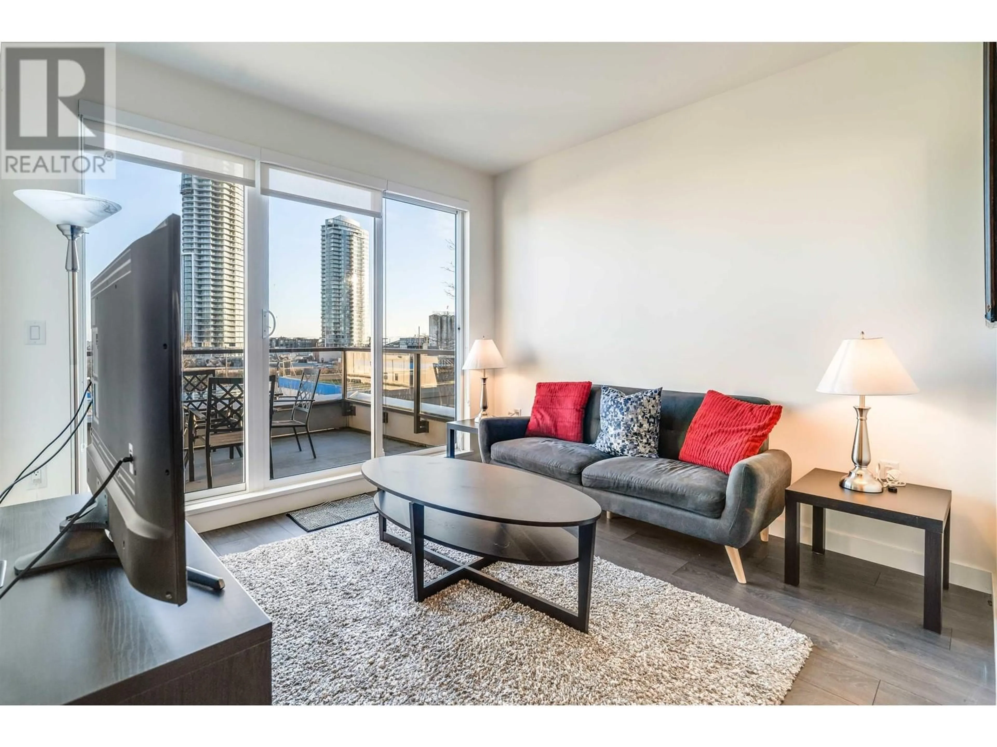 Living room with furniture, wood/laminate floor for 610 - 7169 14TH AVENUE, Burnaby British Columbia V3N0H6
