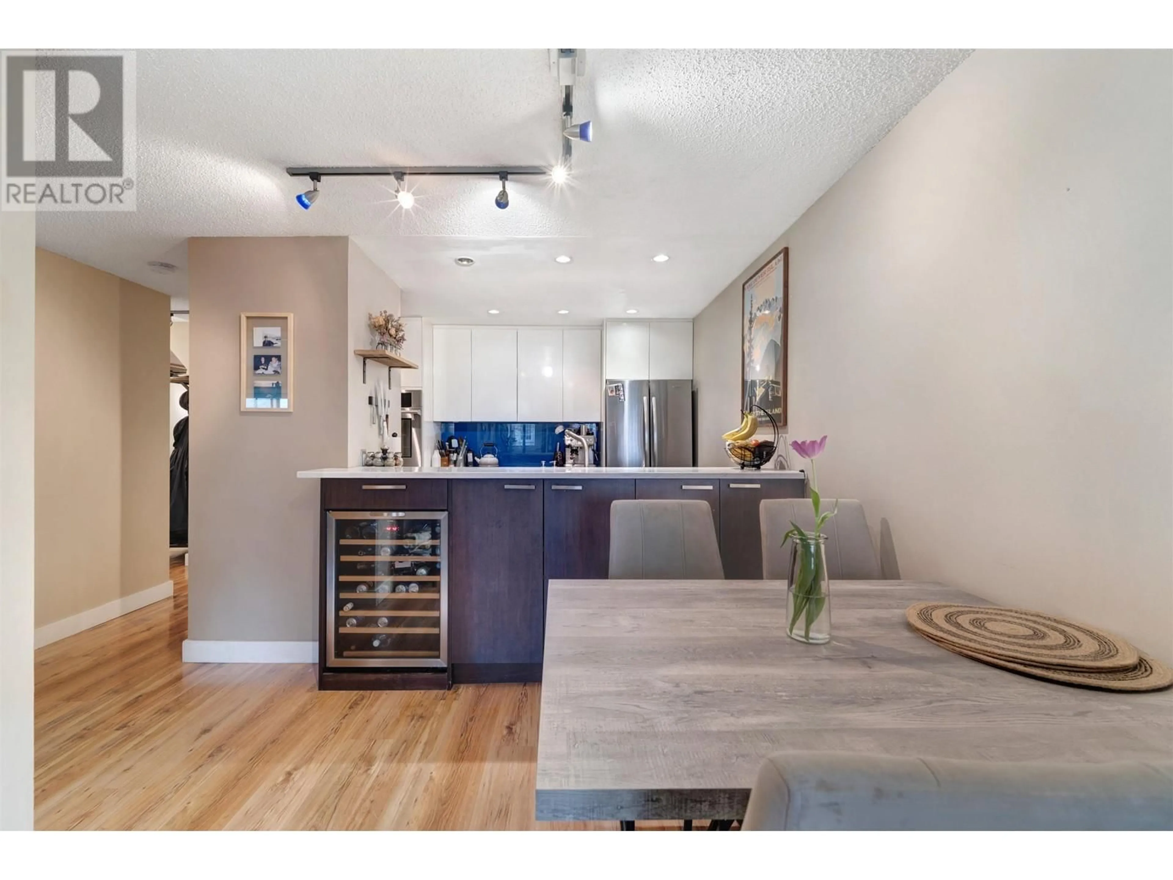 Open concept kitchen, wood/laminate floor for 202 - 936 BUTE STREET, Vancouver British Columbia V6E1Y8