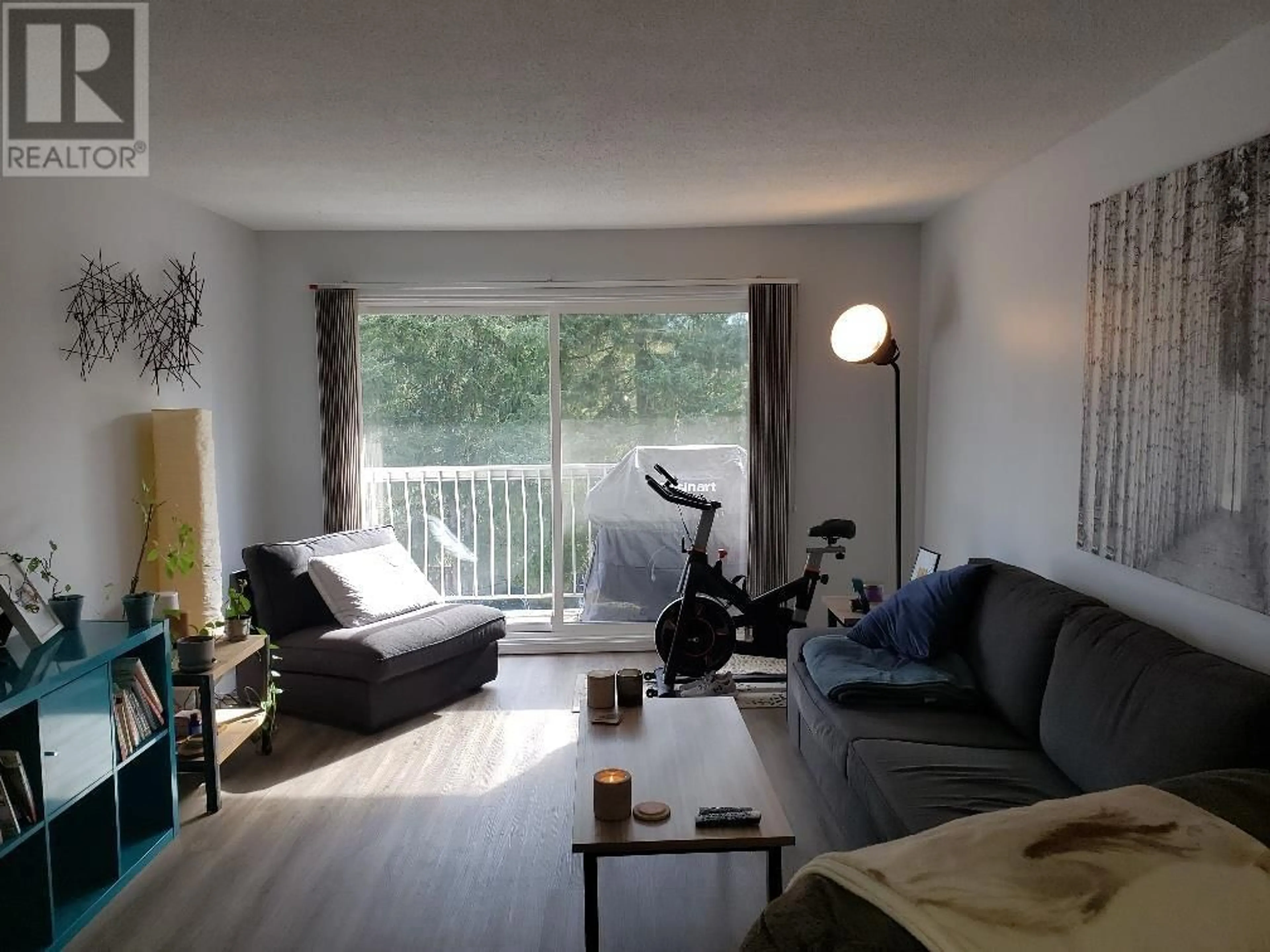 Living room with furniture, wood/laminate floor for 309 - 4931 WALSH AVENUE, Terrace British Columbia V8G1Z1