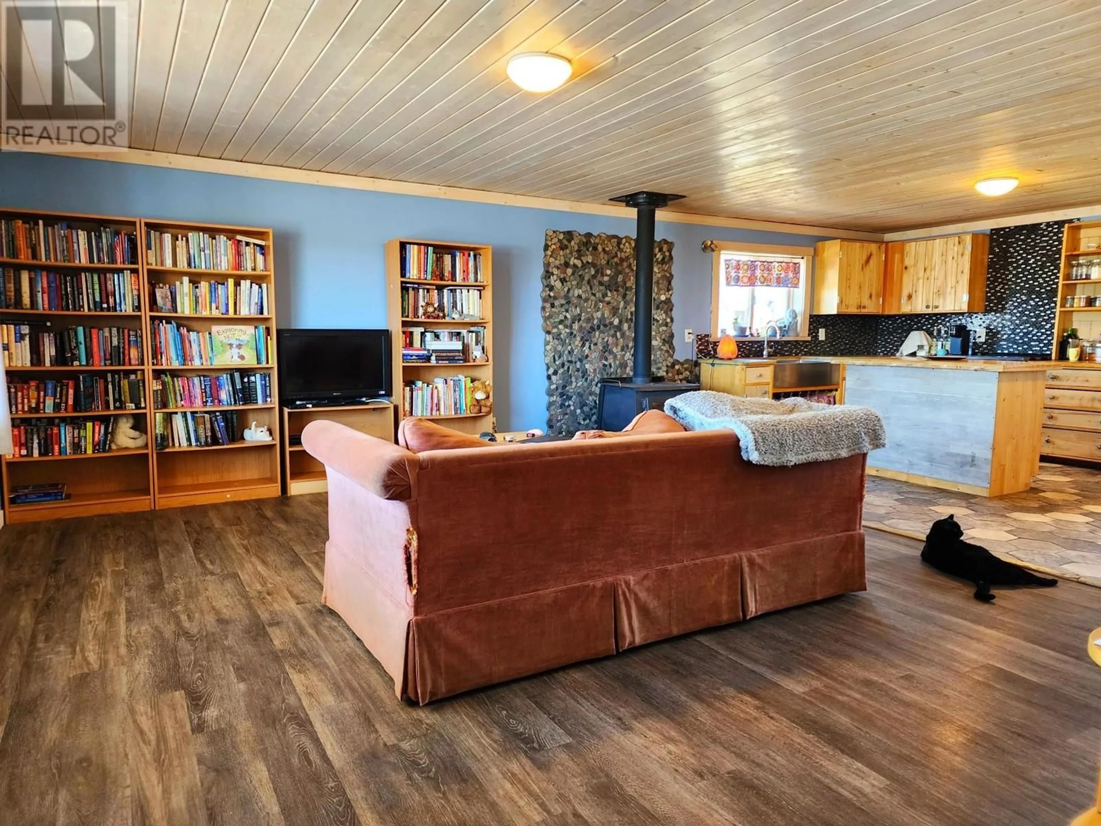 Living room with furniture, wood/laminate floor for 7331 UNCHA LAKE ROAD, Burns Lake British Columbia V0J1E0