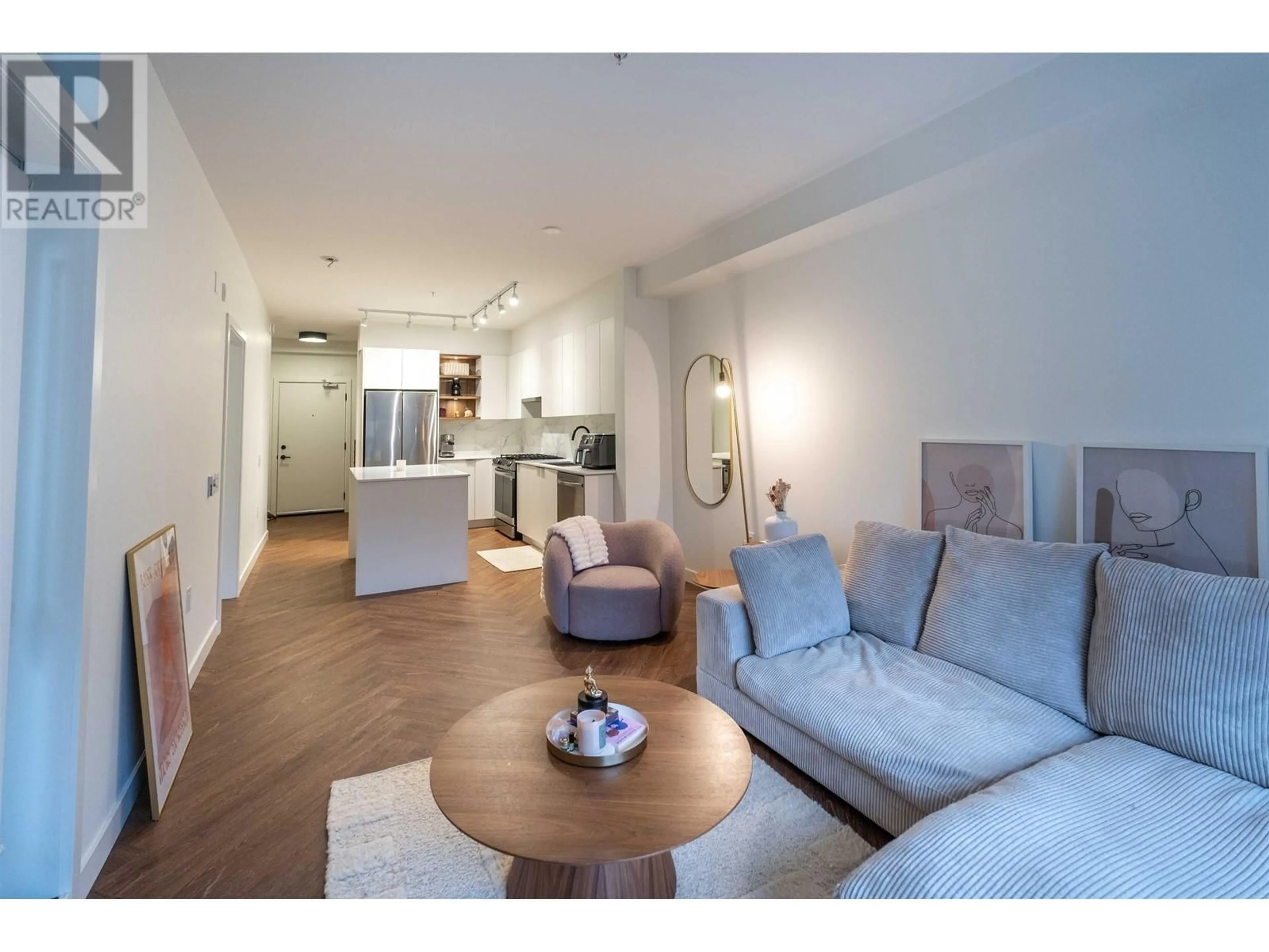 Living room with furniture, wood/laminate floor for 302 - 3229 ST JOHNS STREET, Port Moody British Columbia V3H0M4